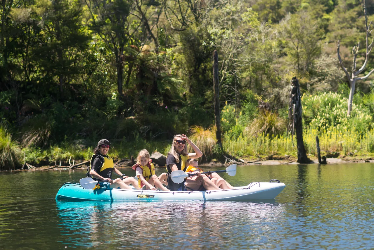 Taiao Adventures - Women and Children kayak on Lake Rotomahana immersed in Waimangu Nature