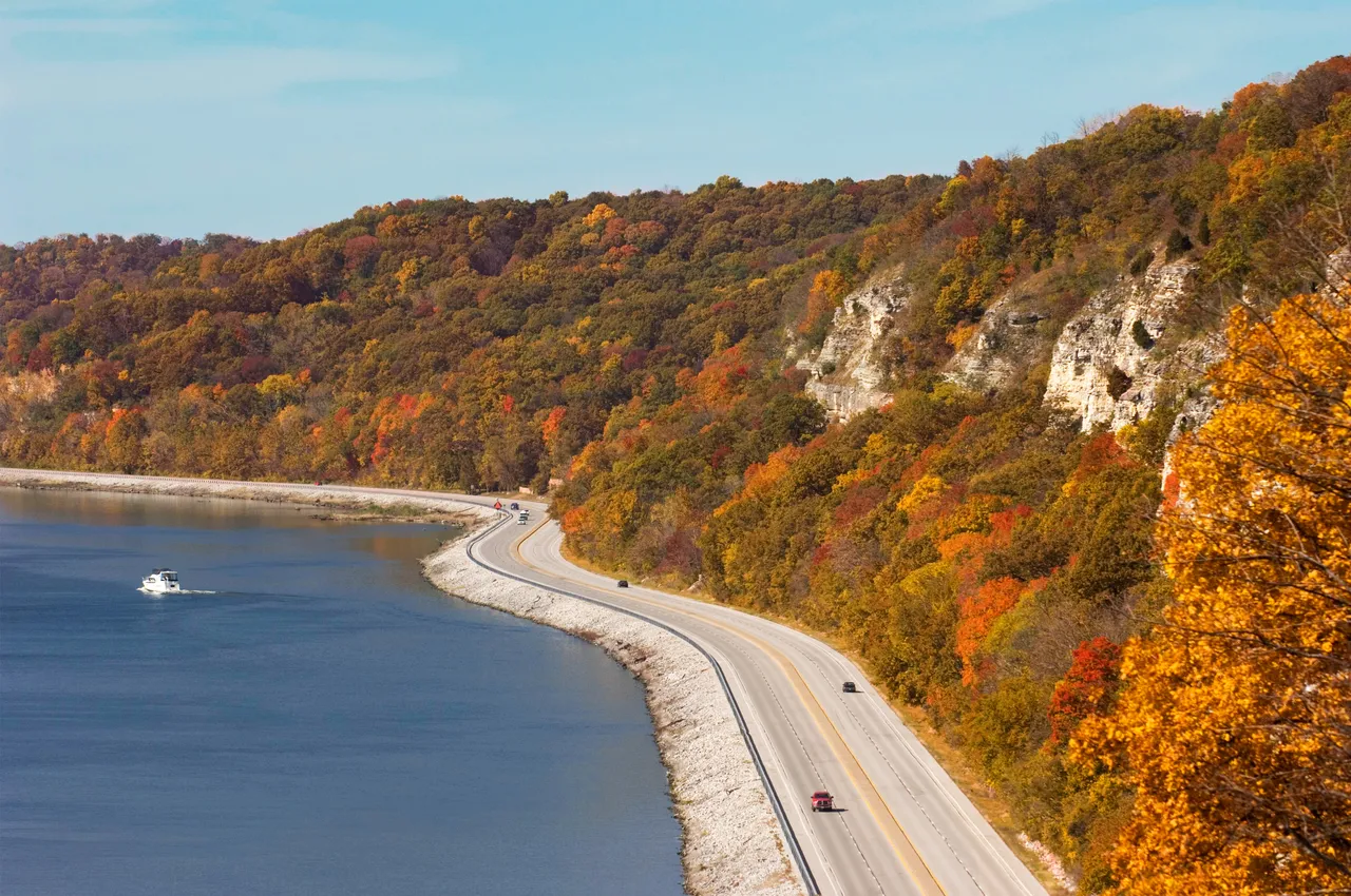 Wide shot of the Great River Road and Mississippi River with autumn and fall colors