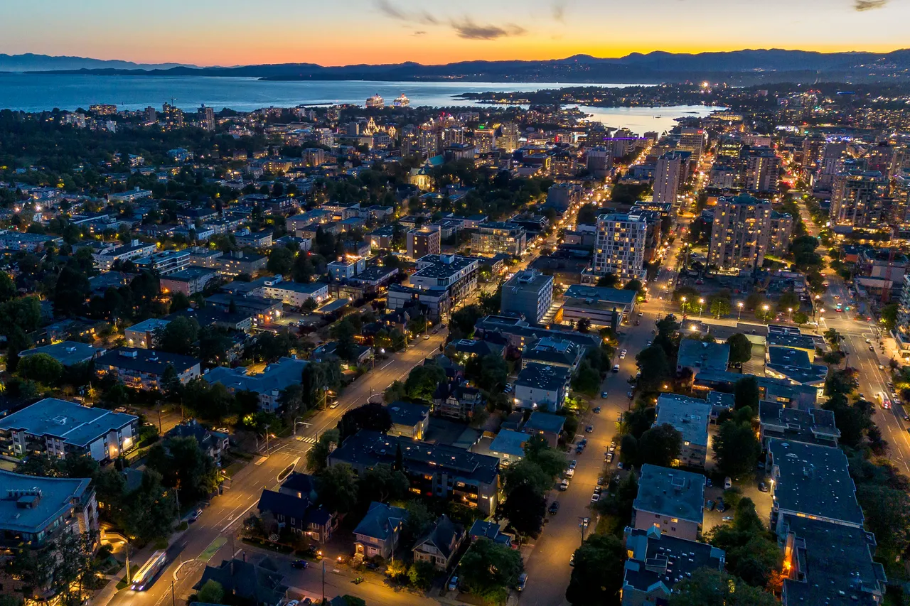Aerial Photo of Downtown Victoria at Night with Mountains on Horizon