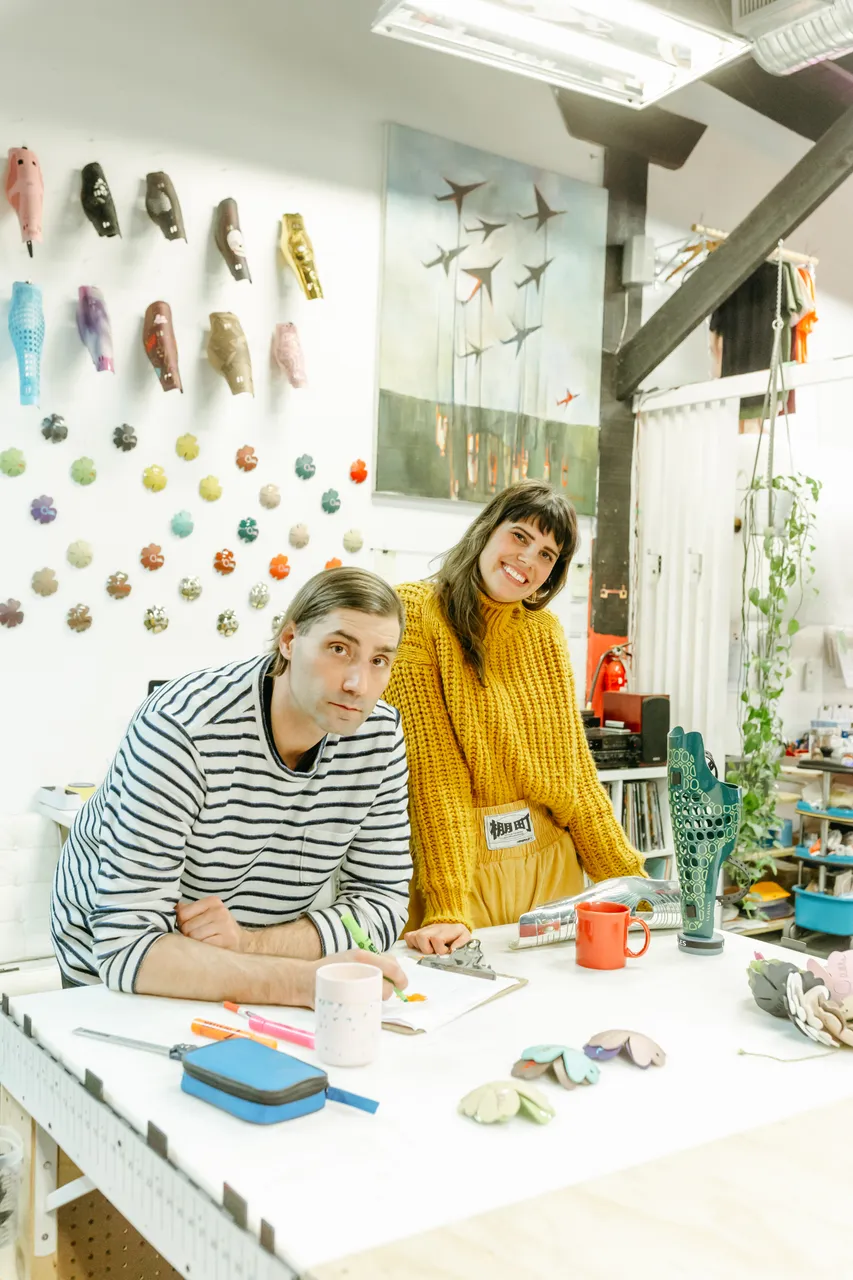 Man and woman reviewing paperwork - 2 - Alleles Design