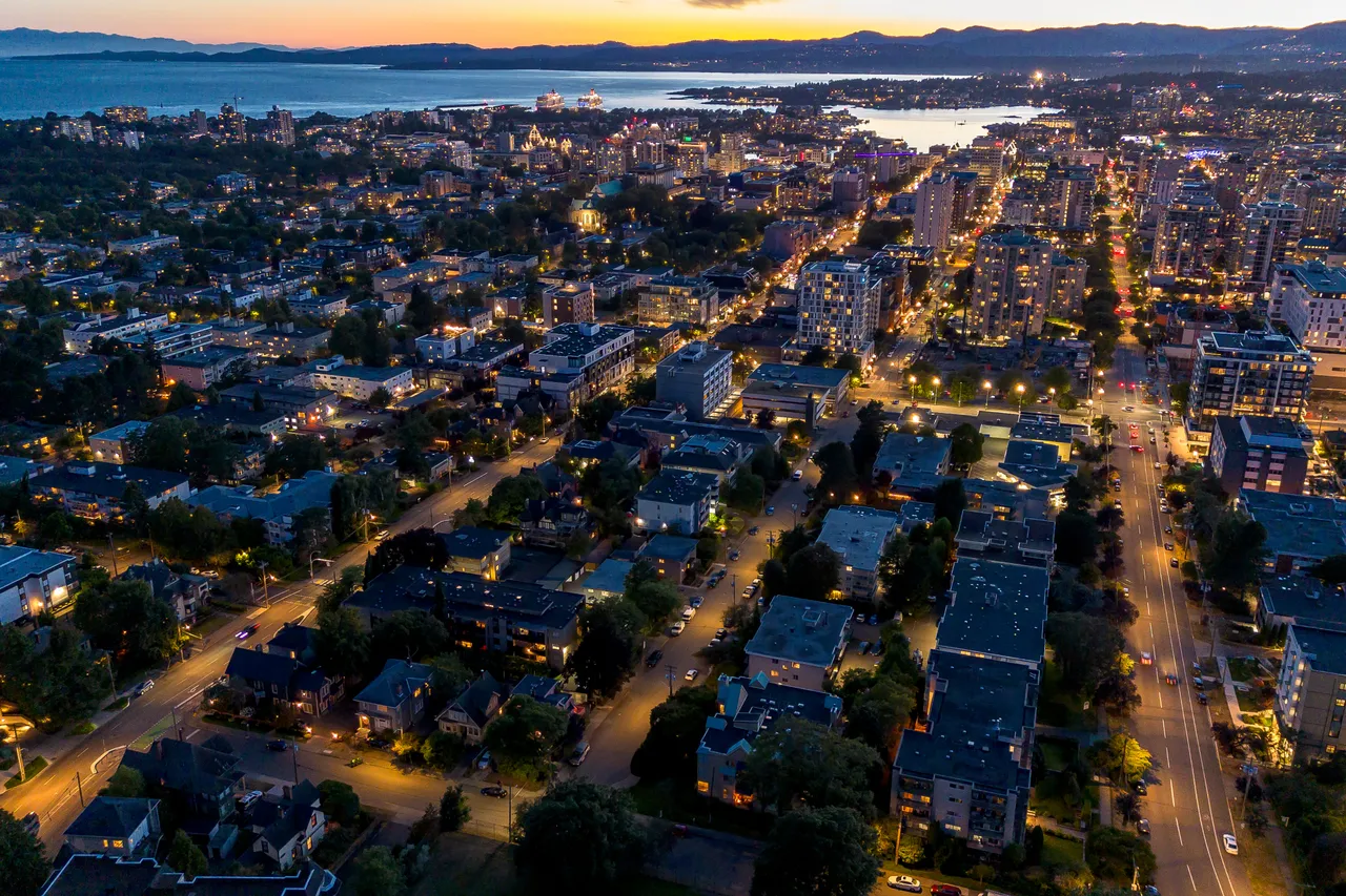 Aerial Photo Overlooking City and Buildings at Night with Roads