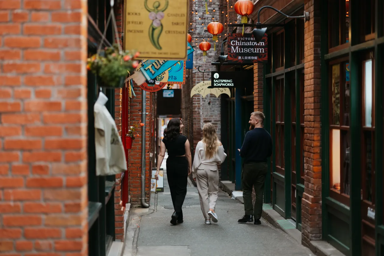 People walking through Fan Tan Alley - 2 - Victoria