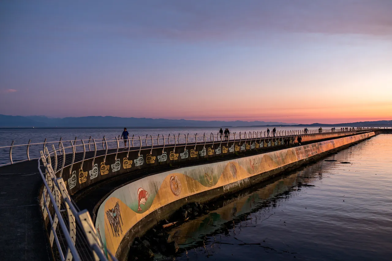 Ogden Point Breakwater at Night with People Walking