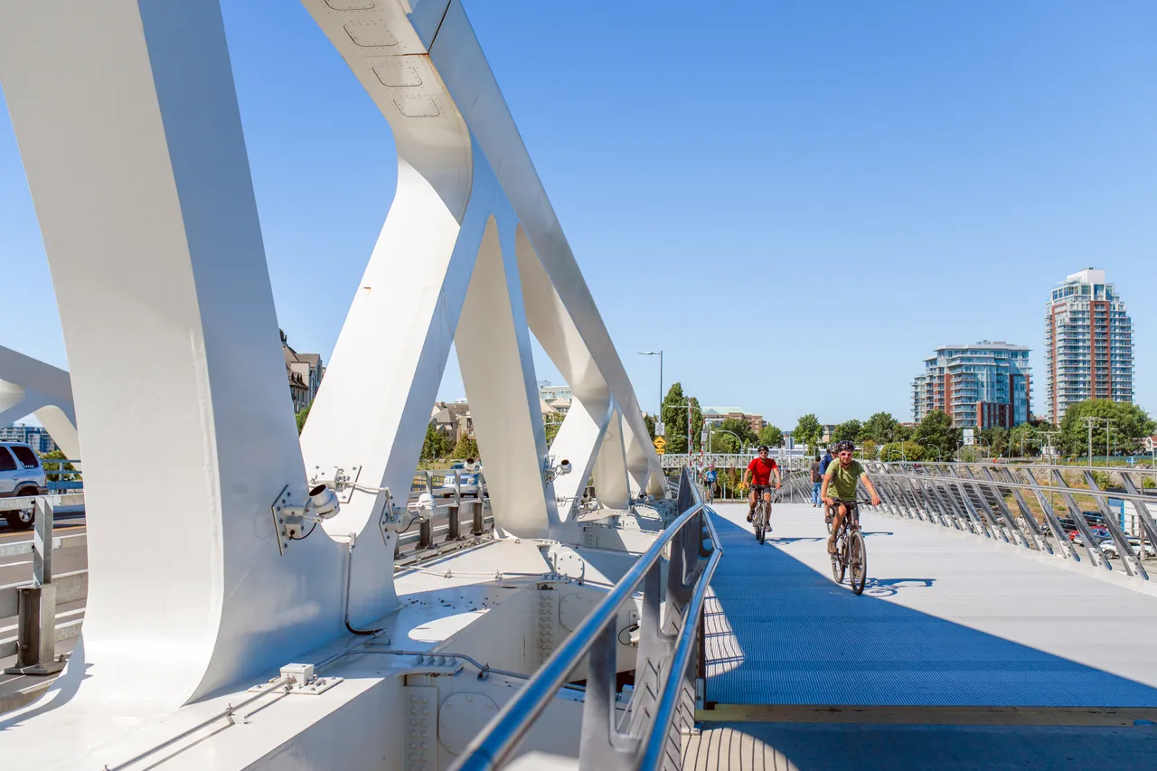Man cycling across bridge - 4 - Victoria