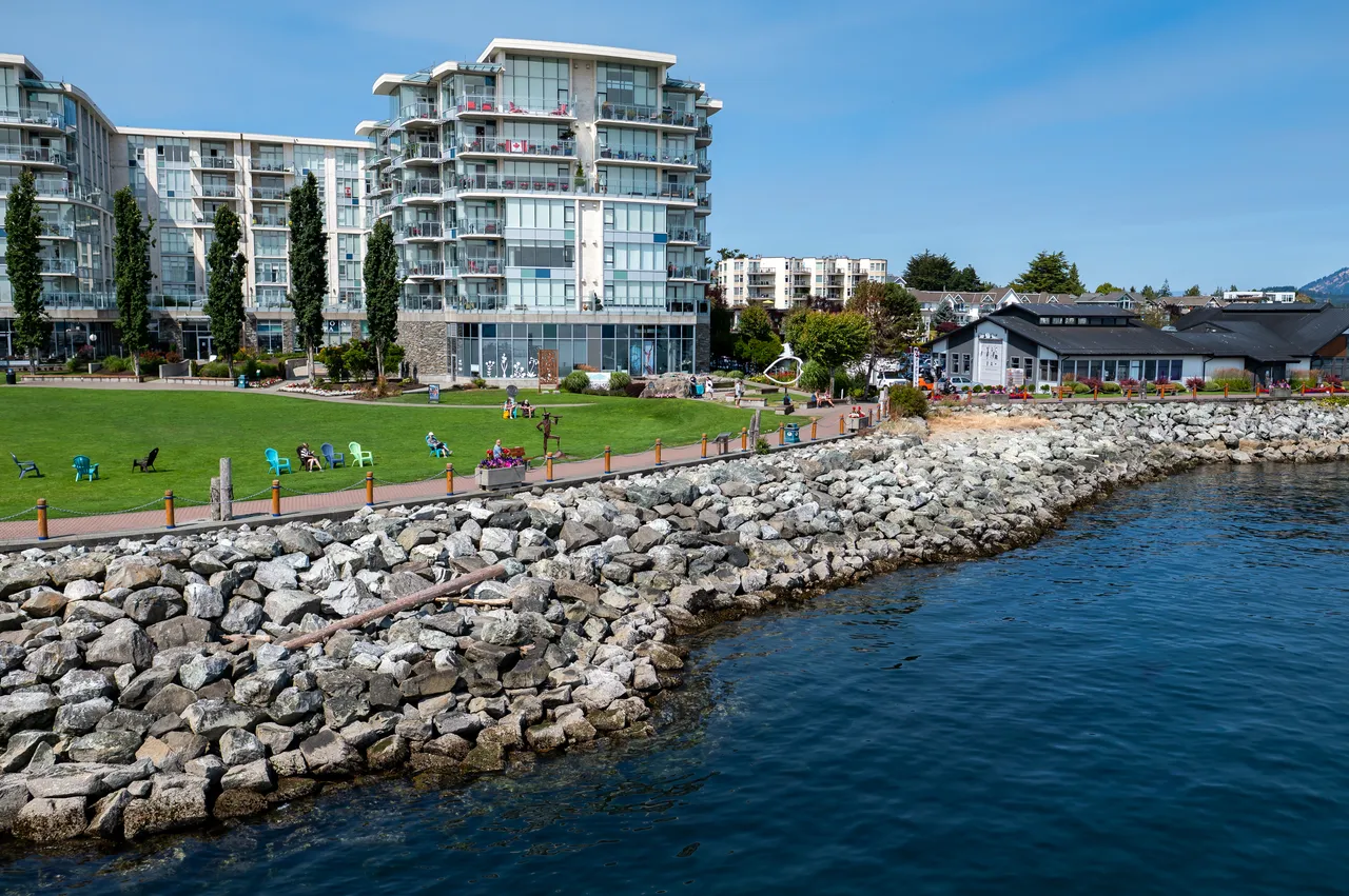 Shoreline with Apartment Buildings, Rocks and Ocean Nearby