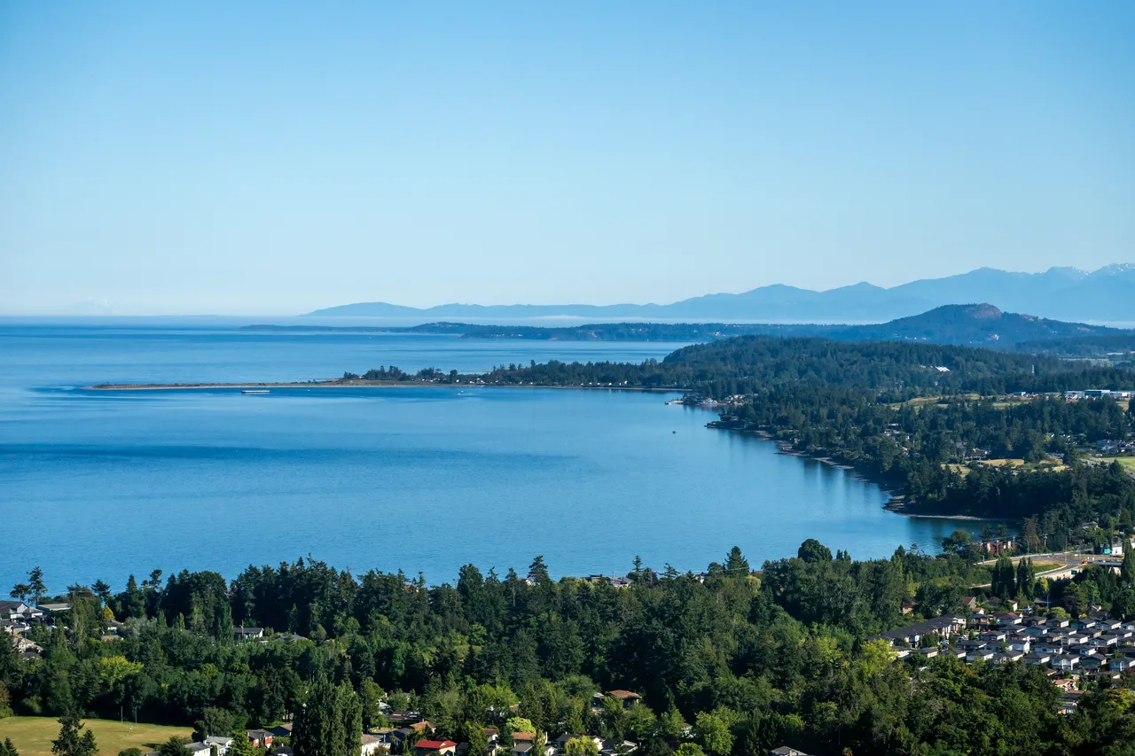 Sidney Looking South Aerial with Ocean, Sky and Mountains