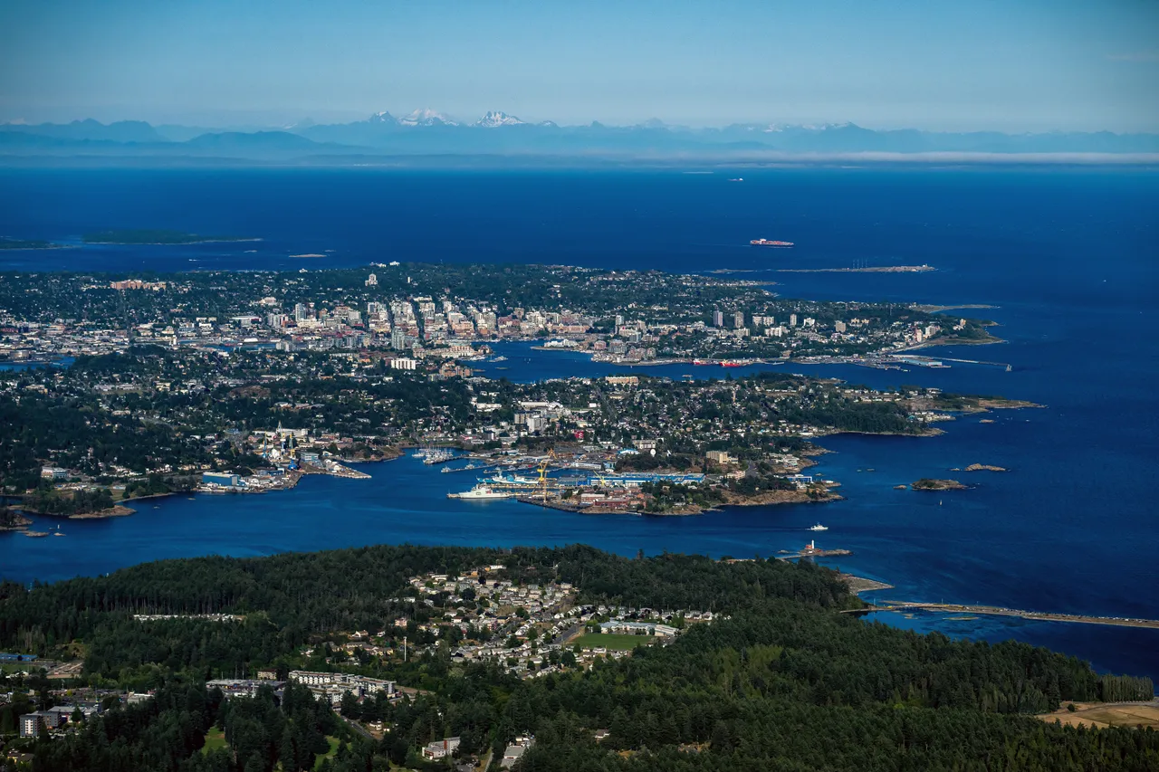 Aerial of Greater Victoria with Mountains, Trees and Ocean