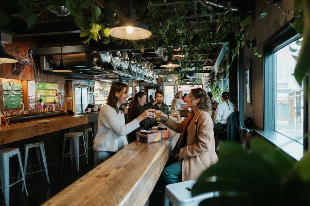 Women clinking beer flights - 2 - Phillips - Victoria