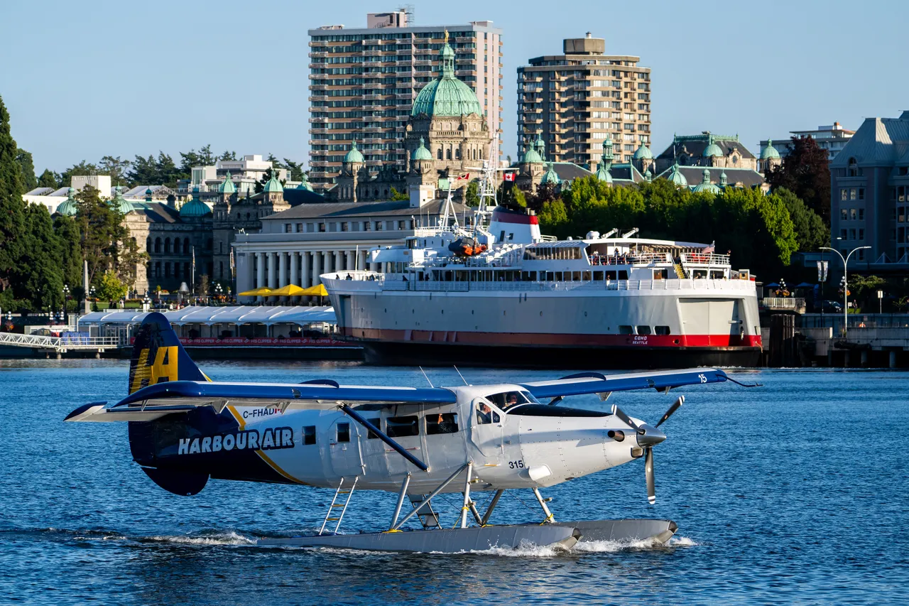 Harbour Plane in Front of Parliament Building with Boat in Background
