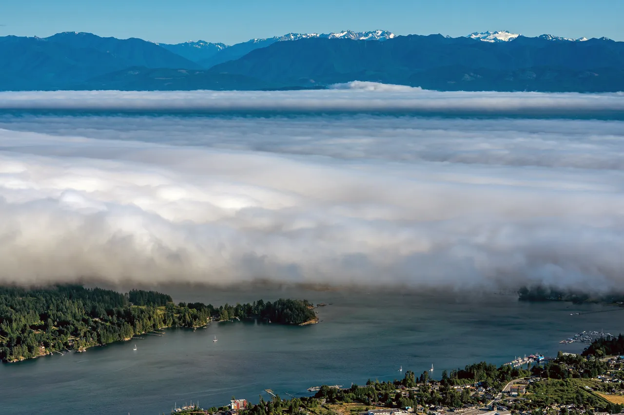 Sooke Aerial with Massive Clouds and Mountains in the Background