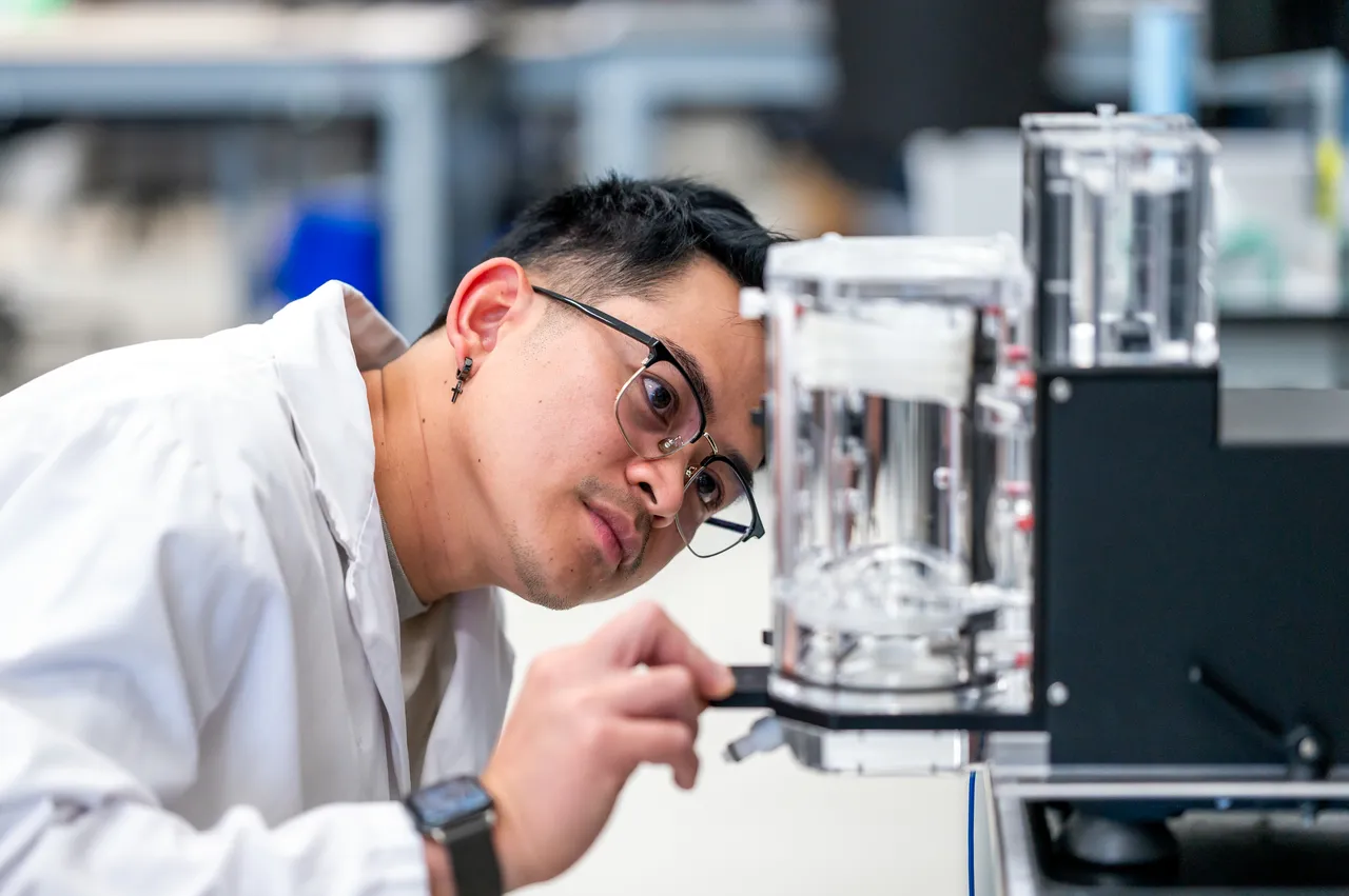 Person with Glasses in Labcoat at Medical Manufacturing Company