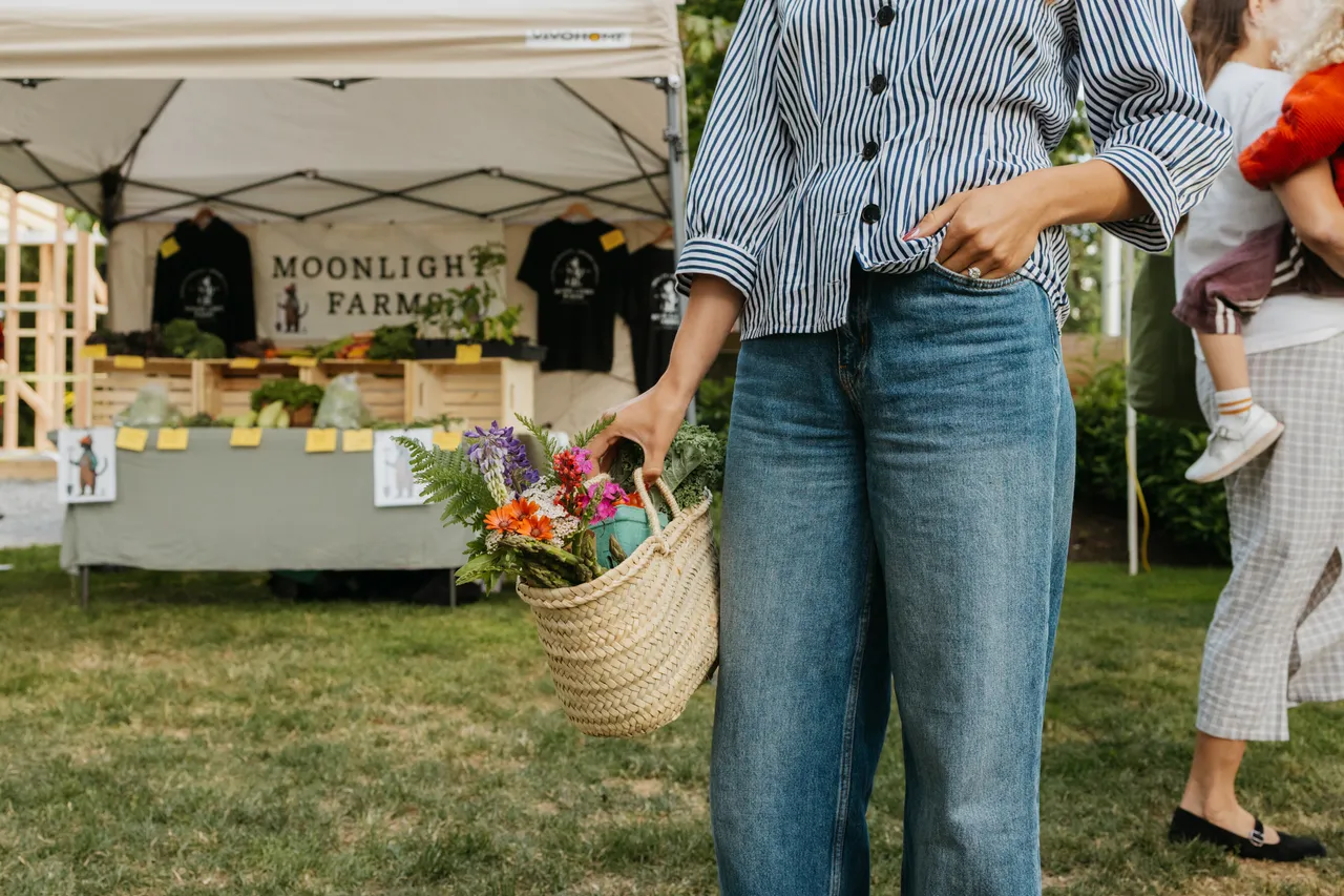 Person Shopping at an Outdoor Farmers Market