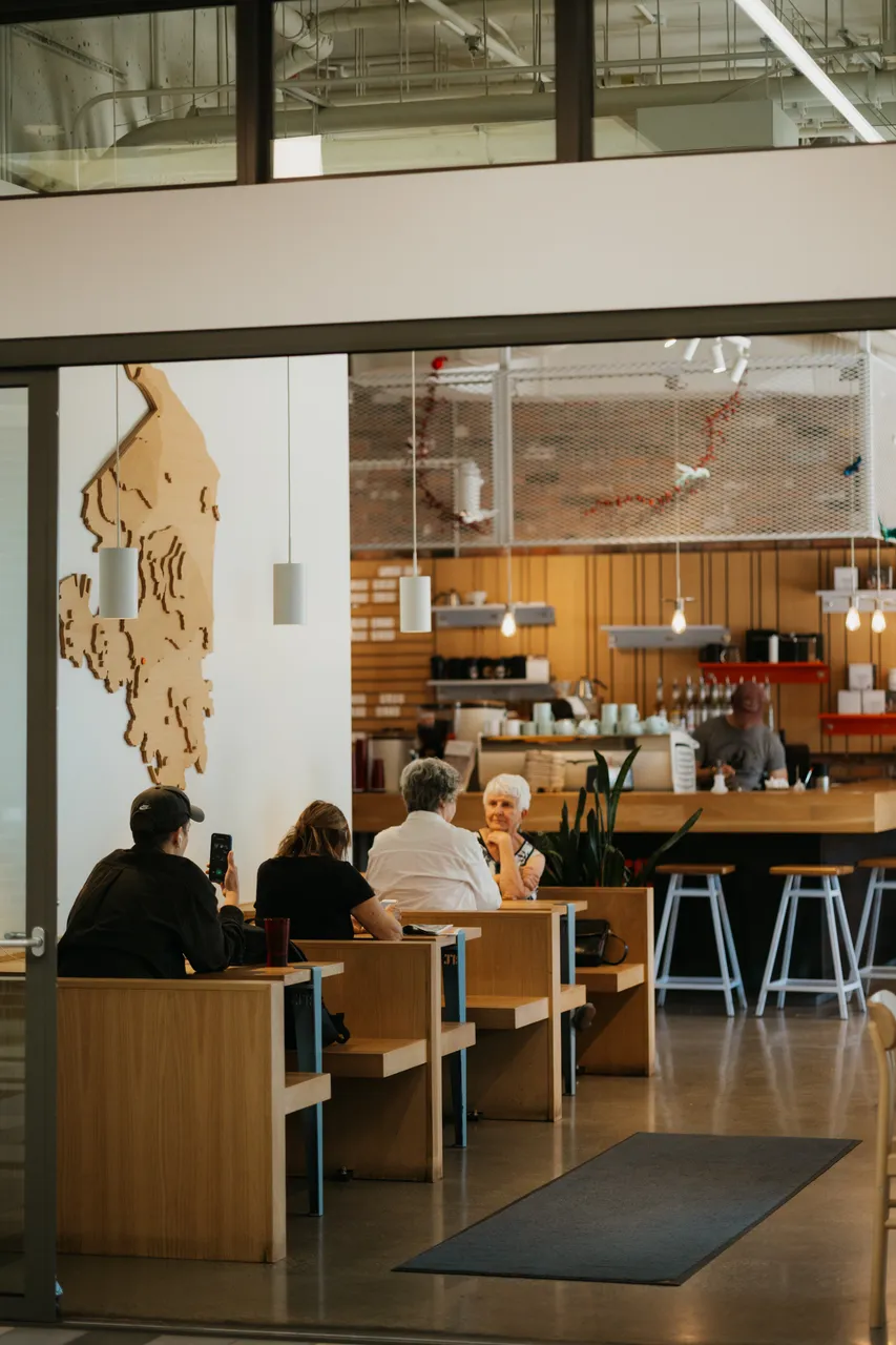 Café Conversation in a Modern Community Space Between Couple