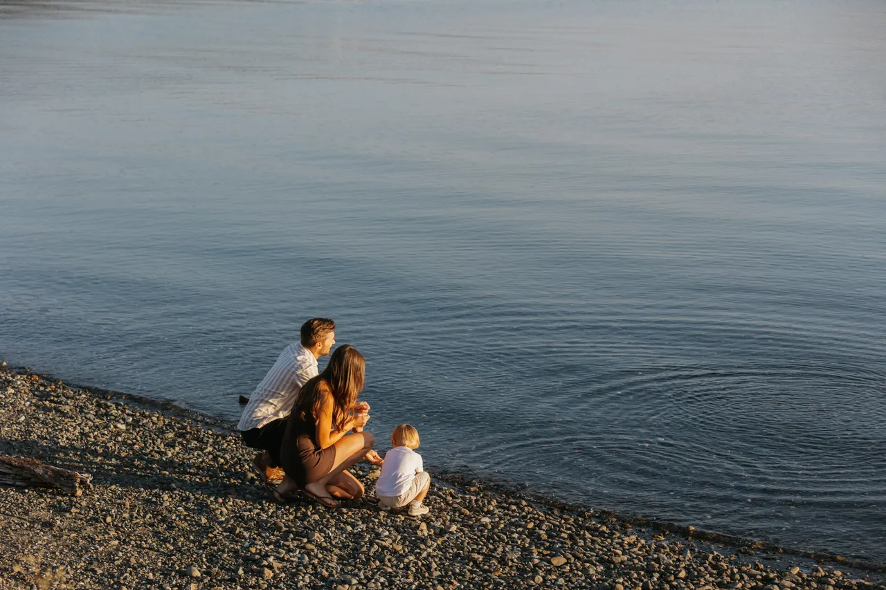 Family enjoying a calm evening by the water