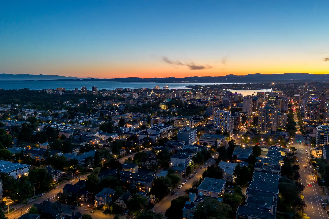 Aerial Photo Overlooking City at Night with Buildings