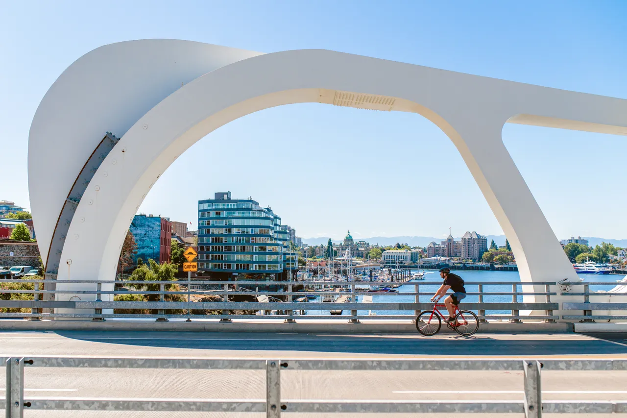 Man cycling across bridge - 3 - Victoria