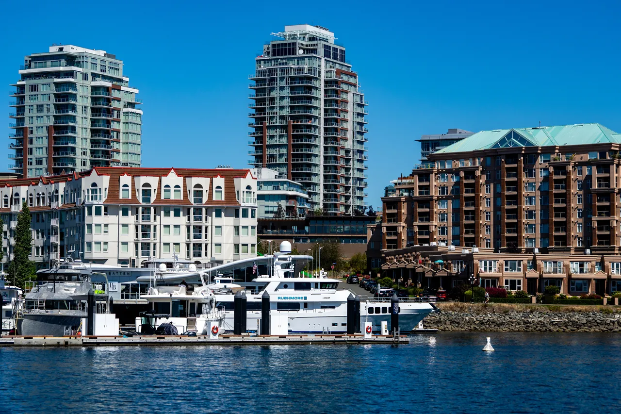 Downtown Victoria Harbour with Boats and Apartment Buildings in Background during Day Time