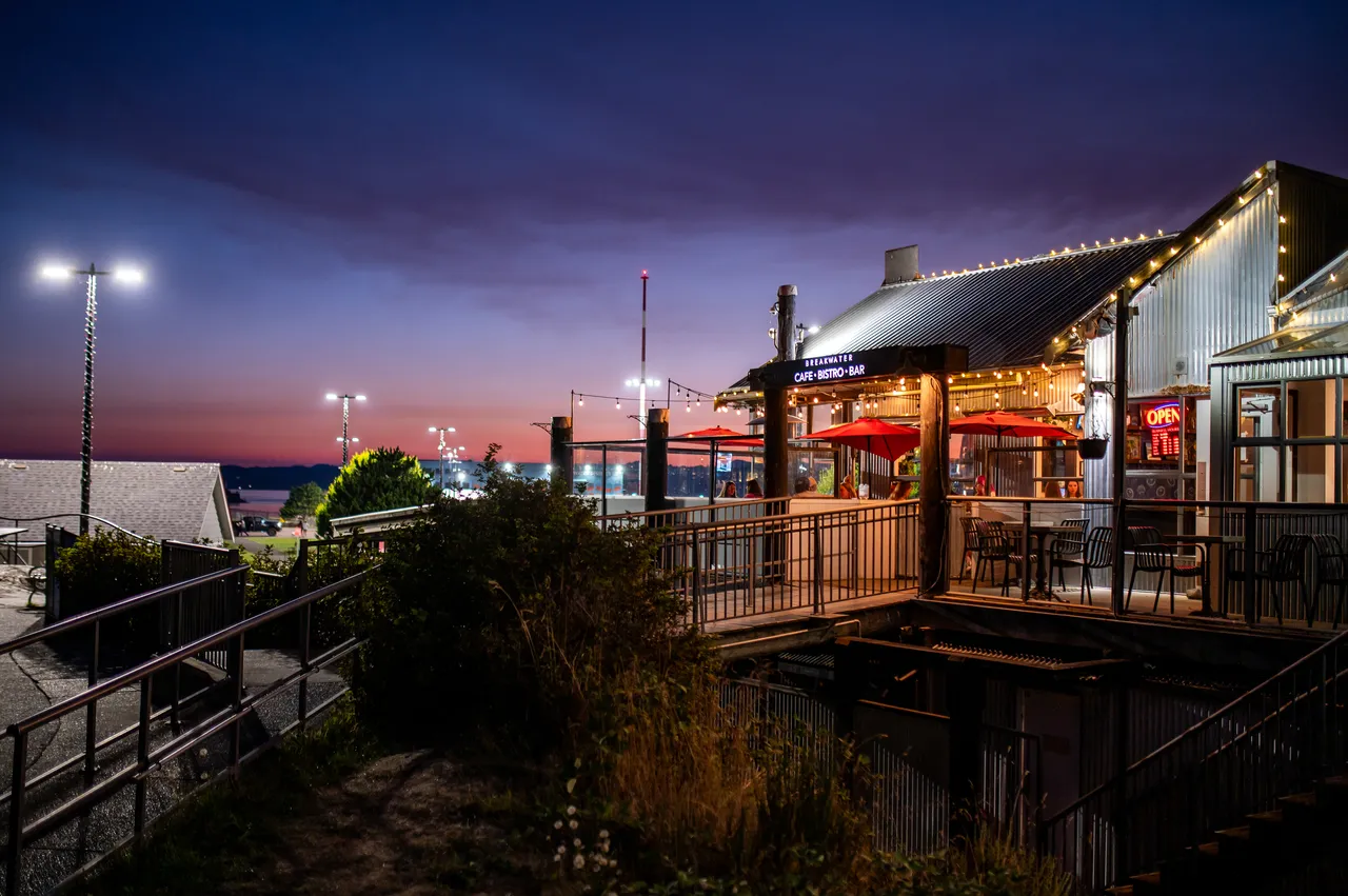Breakwater Bistro at Night with Bright Lights and Walkway