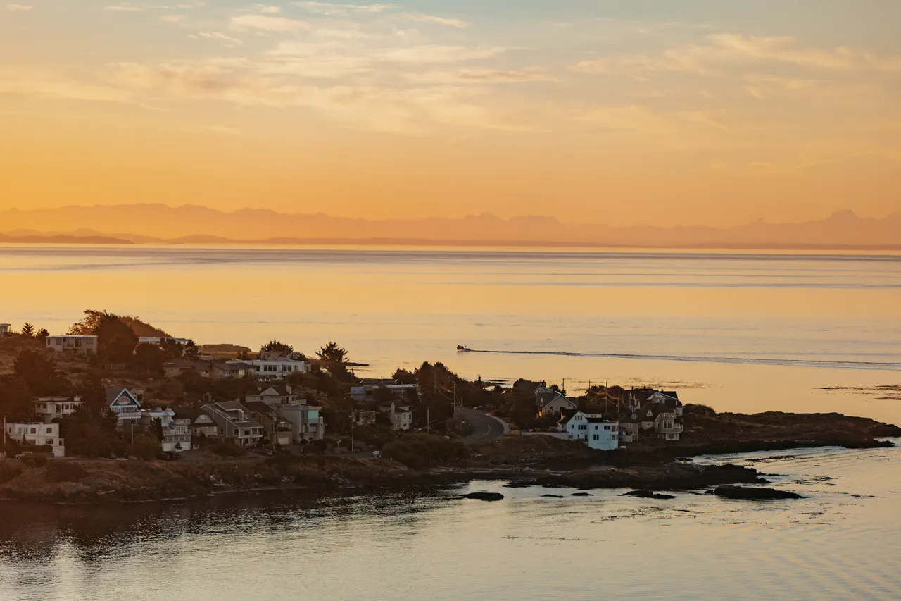 Serene evening over a coastal hillside community