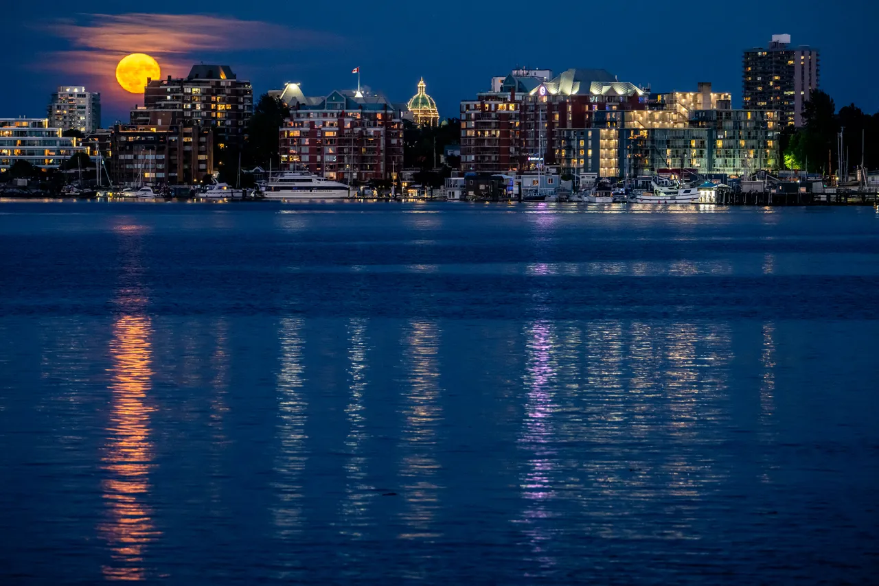 Downtown Victoria Harbour with Moon, Water, Boats and Tall Buildings