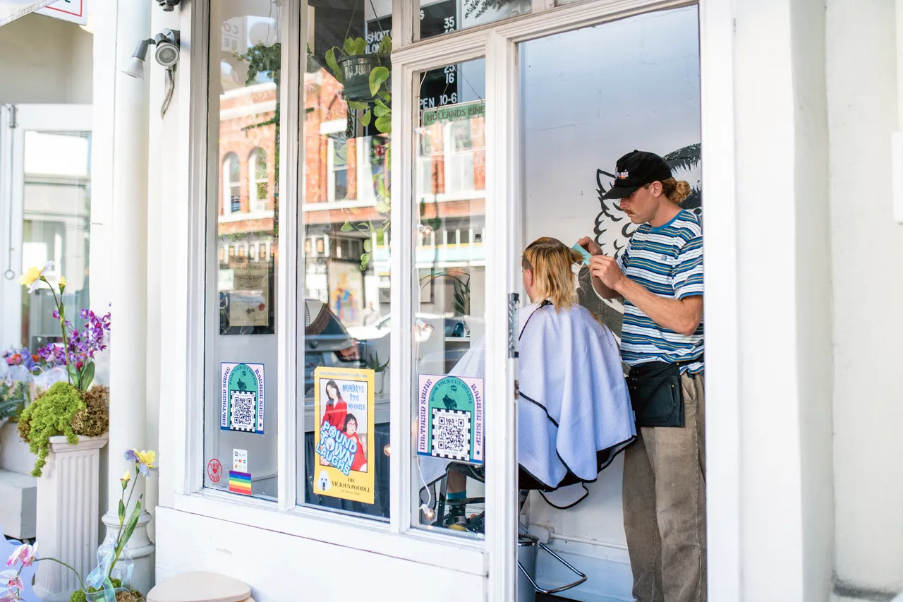 Man receiving haircut in barbershop - Victoria