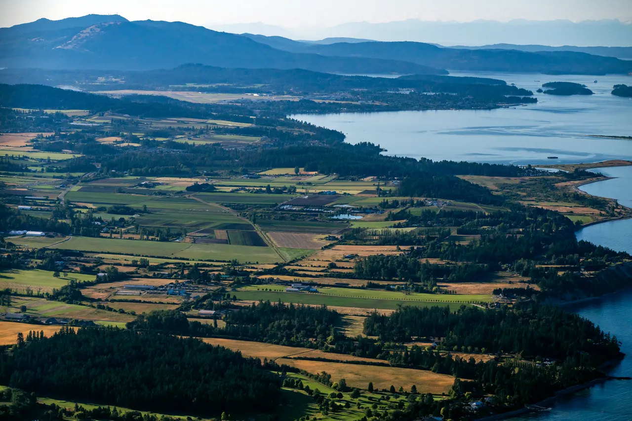 Saanich and Gulf Islands looking North Aerial with Farmland and Trees