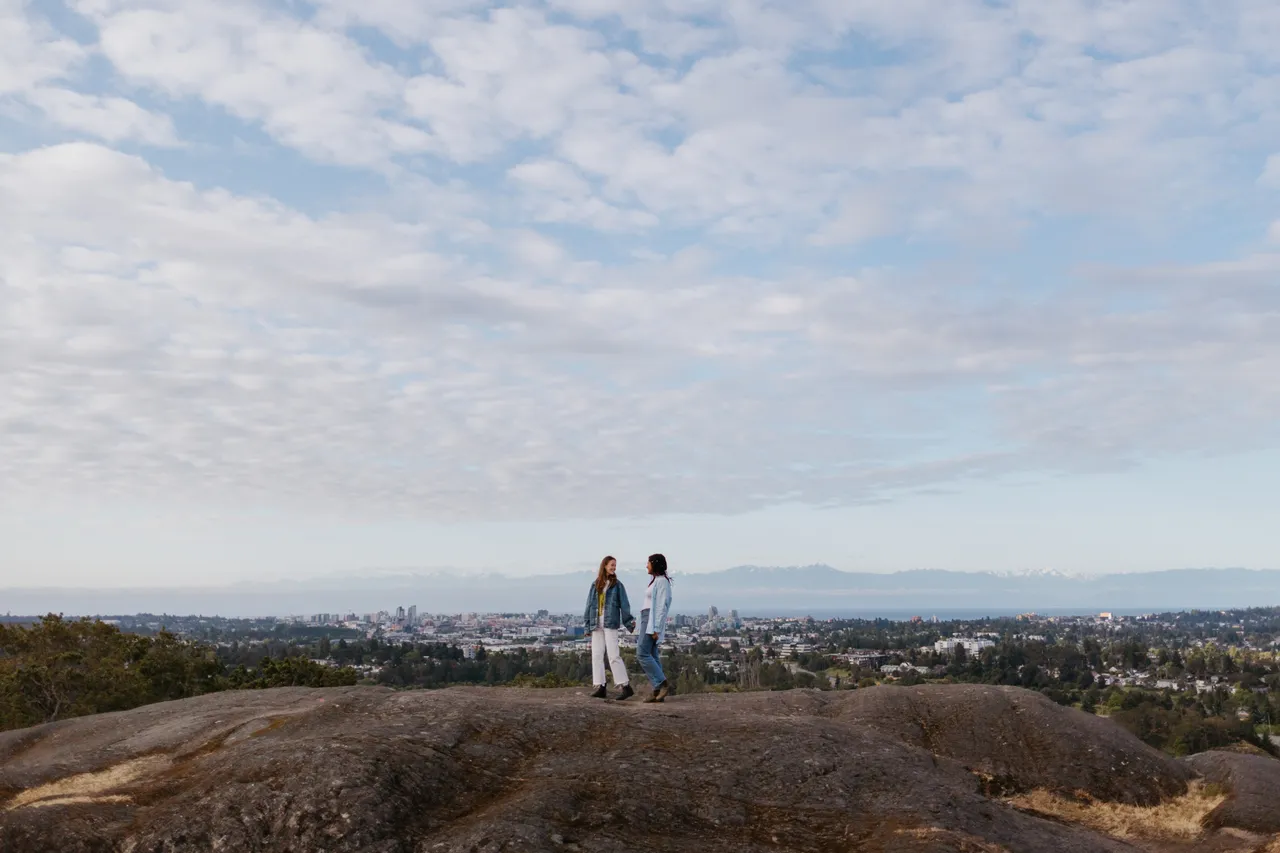 Couple enjoying a panoramic hilltop view