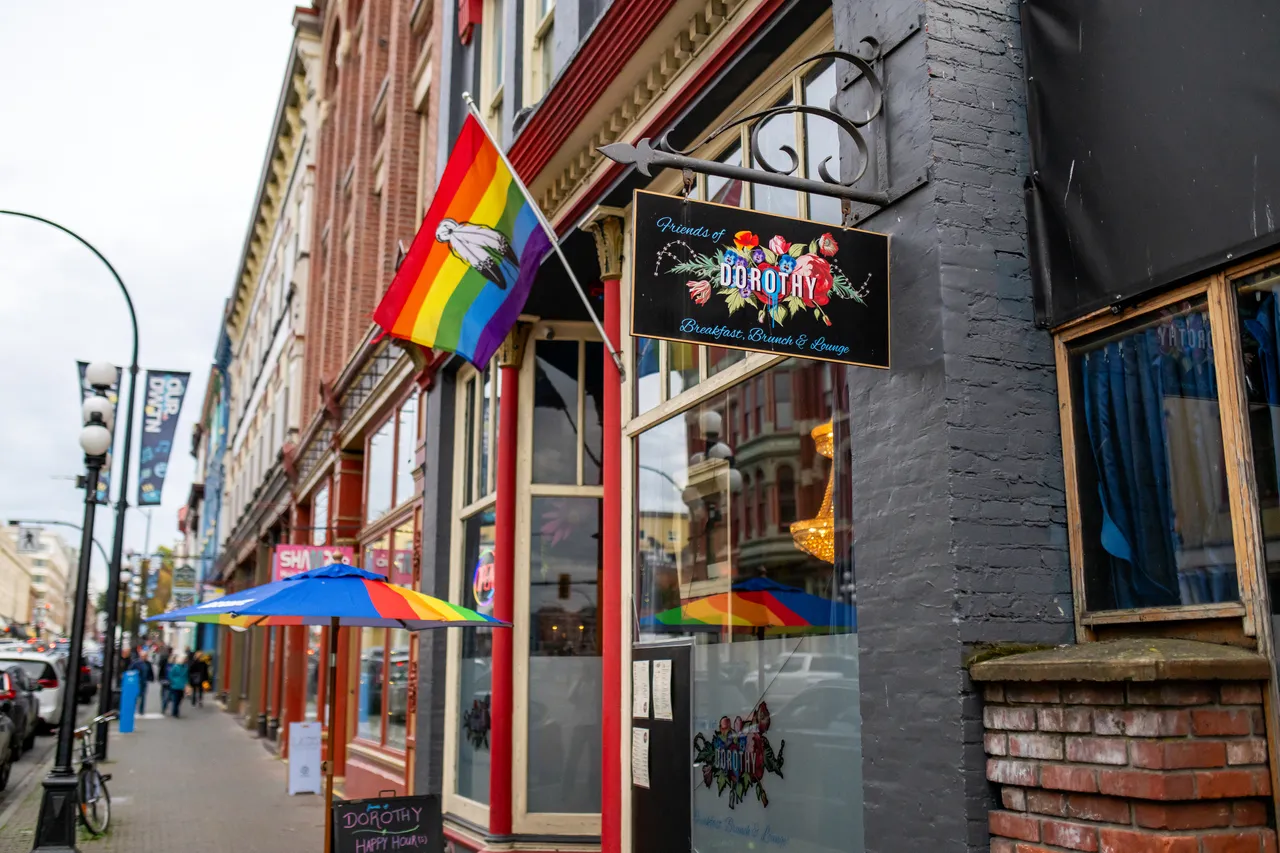 Outside Friends of Dorothy with Pride Flag, Rainbow Umbrella and Glass Windows