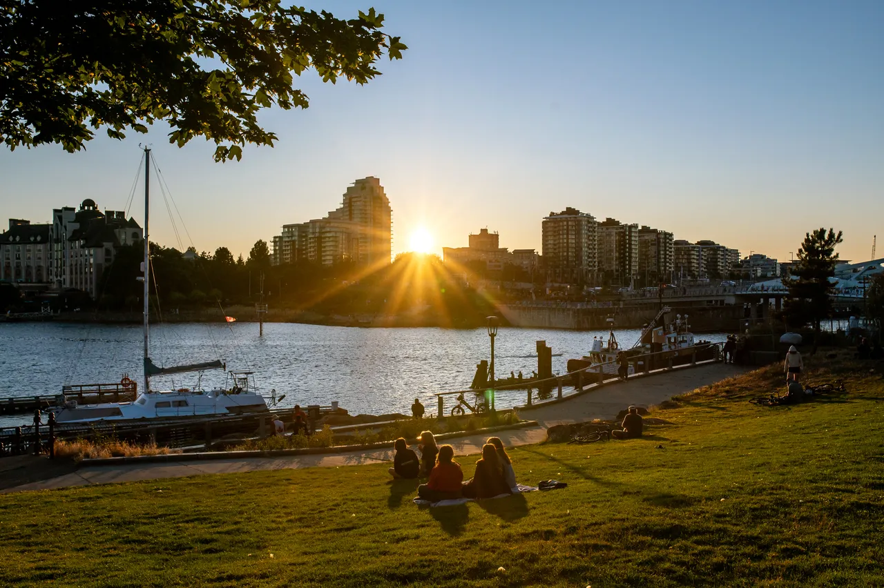Friends Watching the Sun Set Over Victoria Harbour