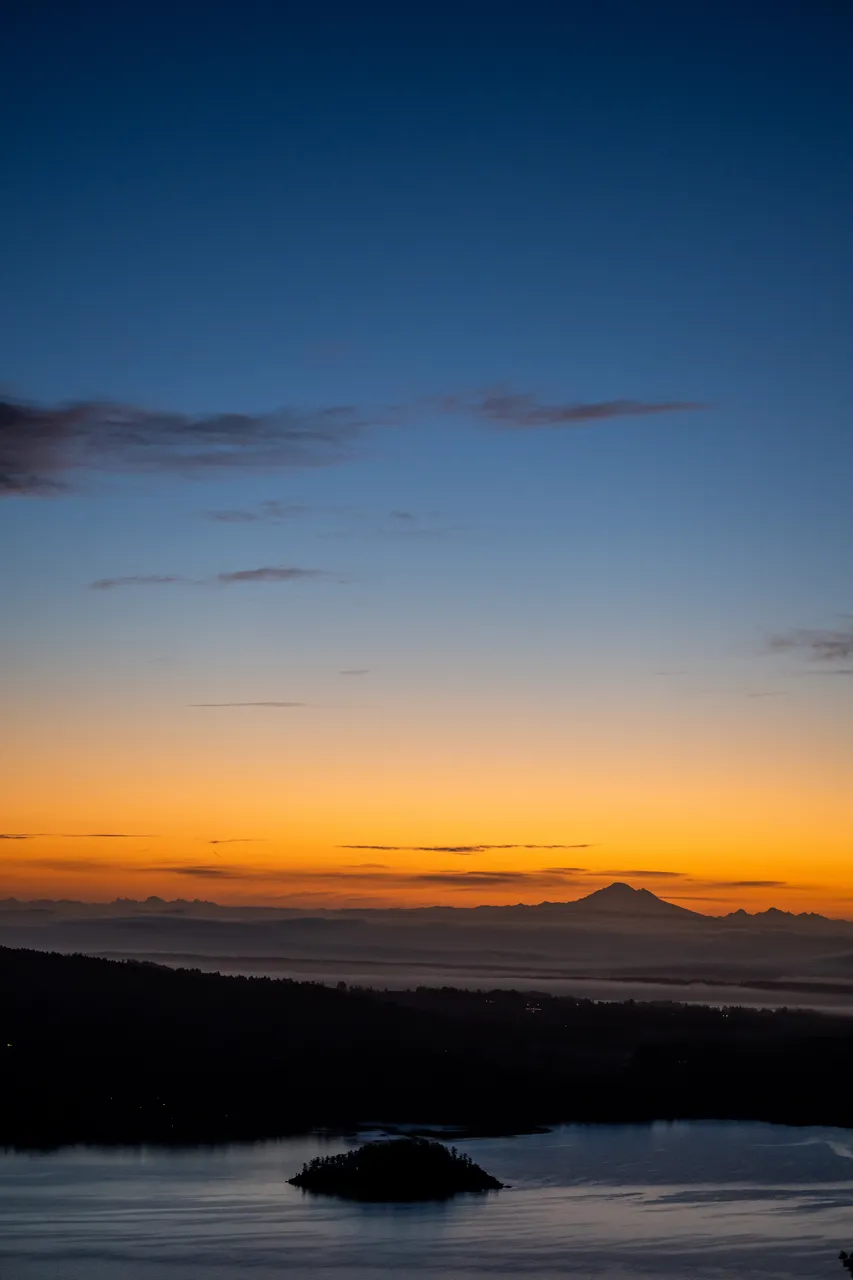Aerial Photo of Sunset Overlooking with Blue and Orange Sky and Mountains
