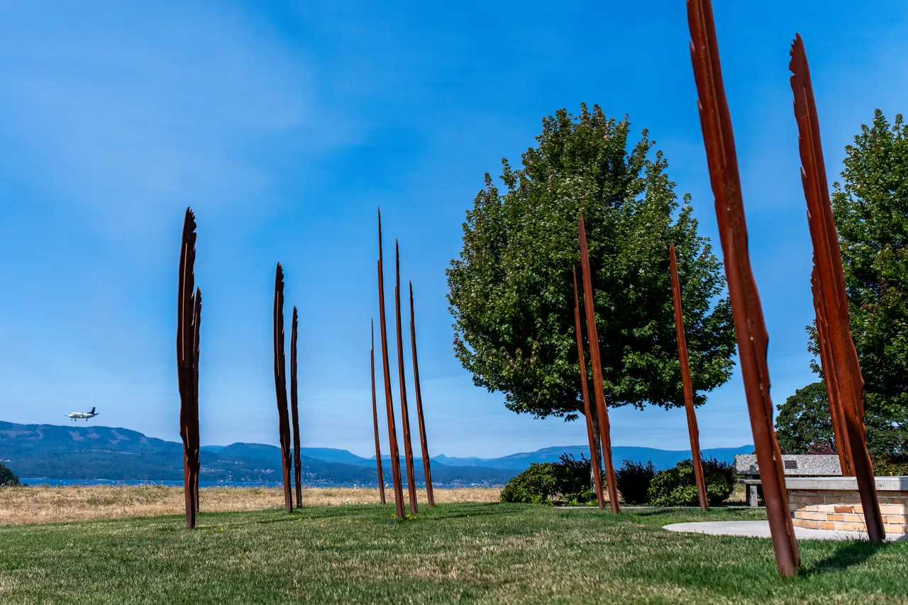 Art Structure with Blue Sky and Plane in Background