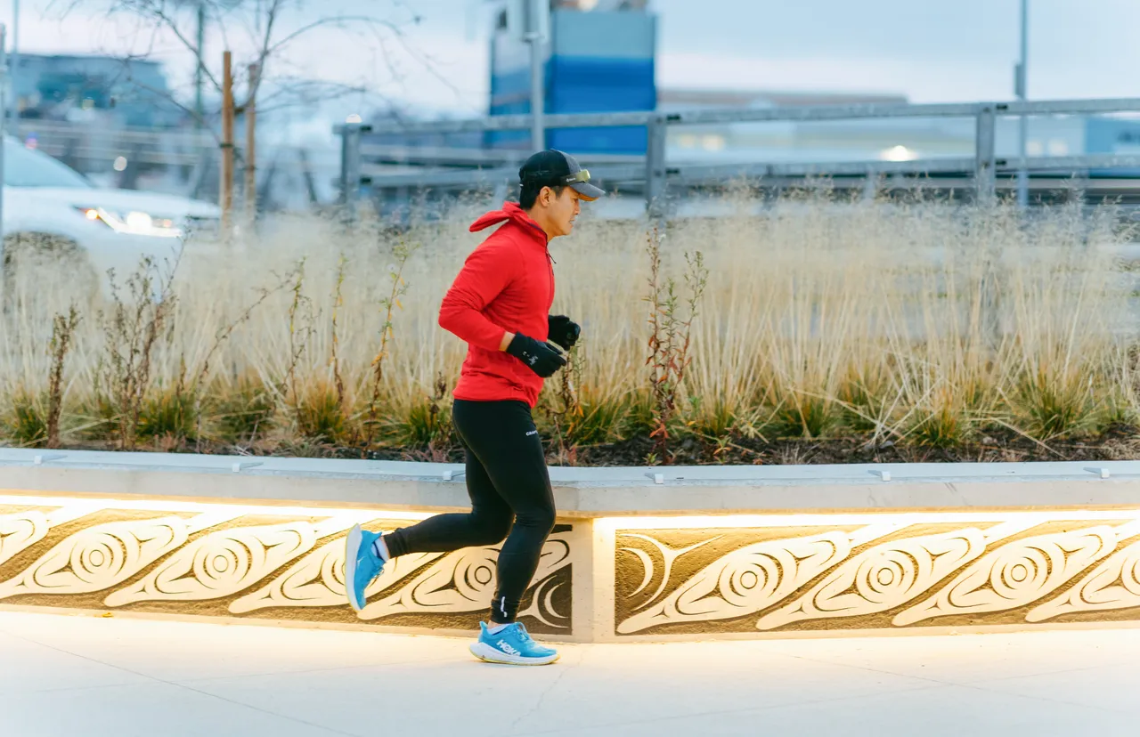 Man running by artwork