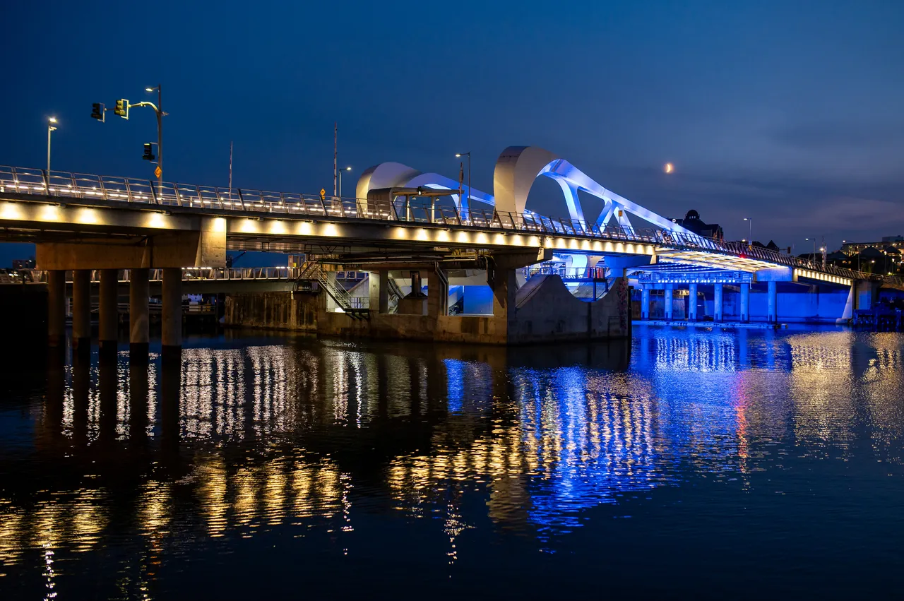 Blue and Gold Bridge Lights Shimmering on Victoria Harbour