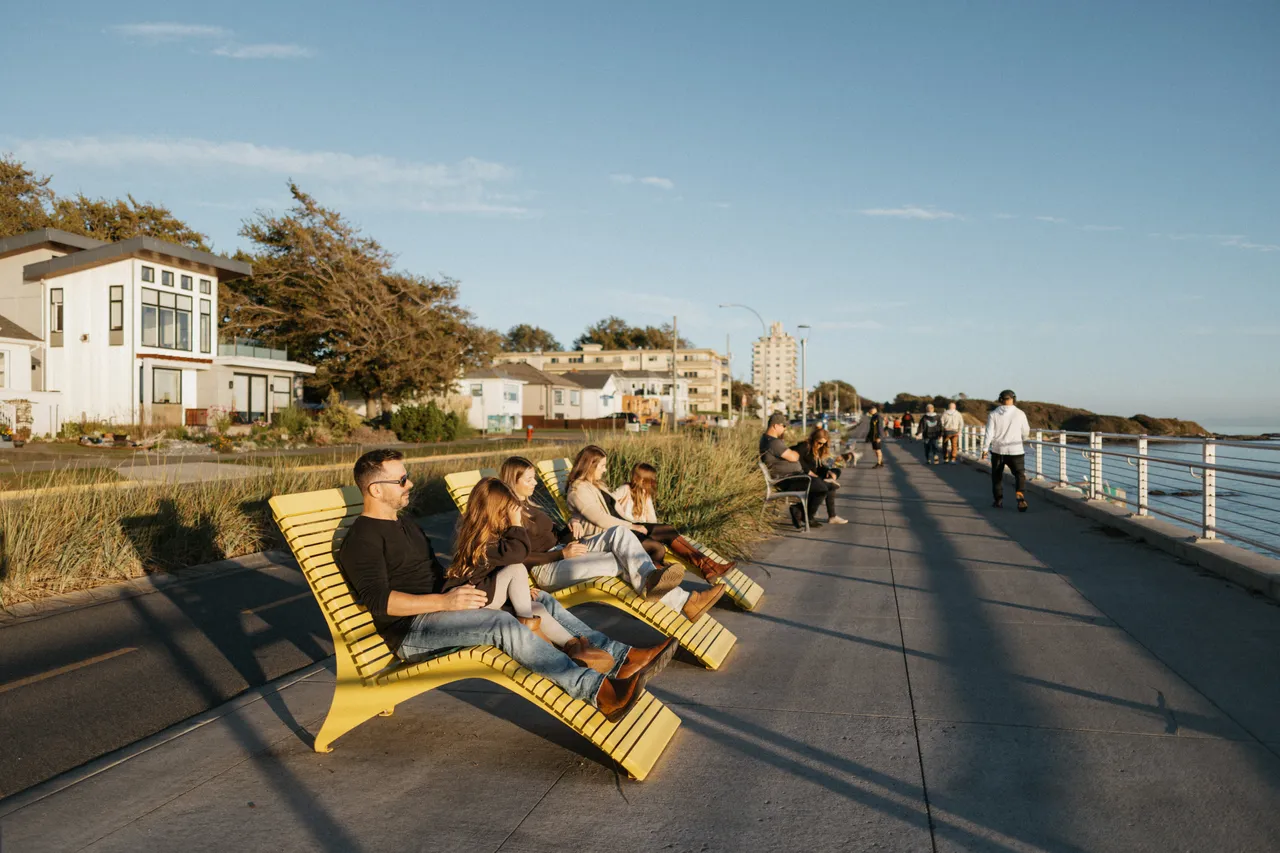 People lounging by ocean - 4