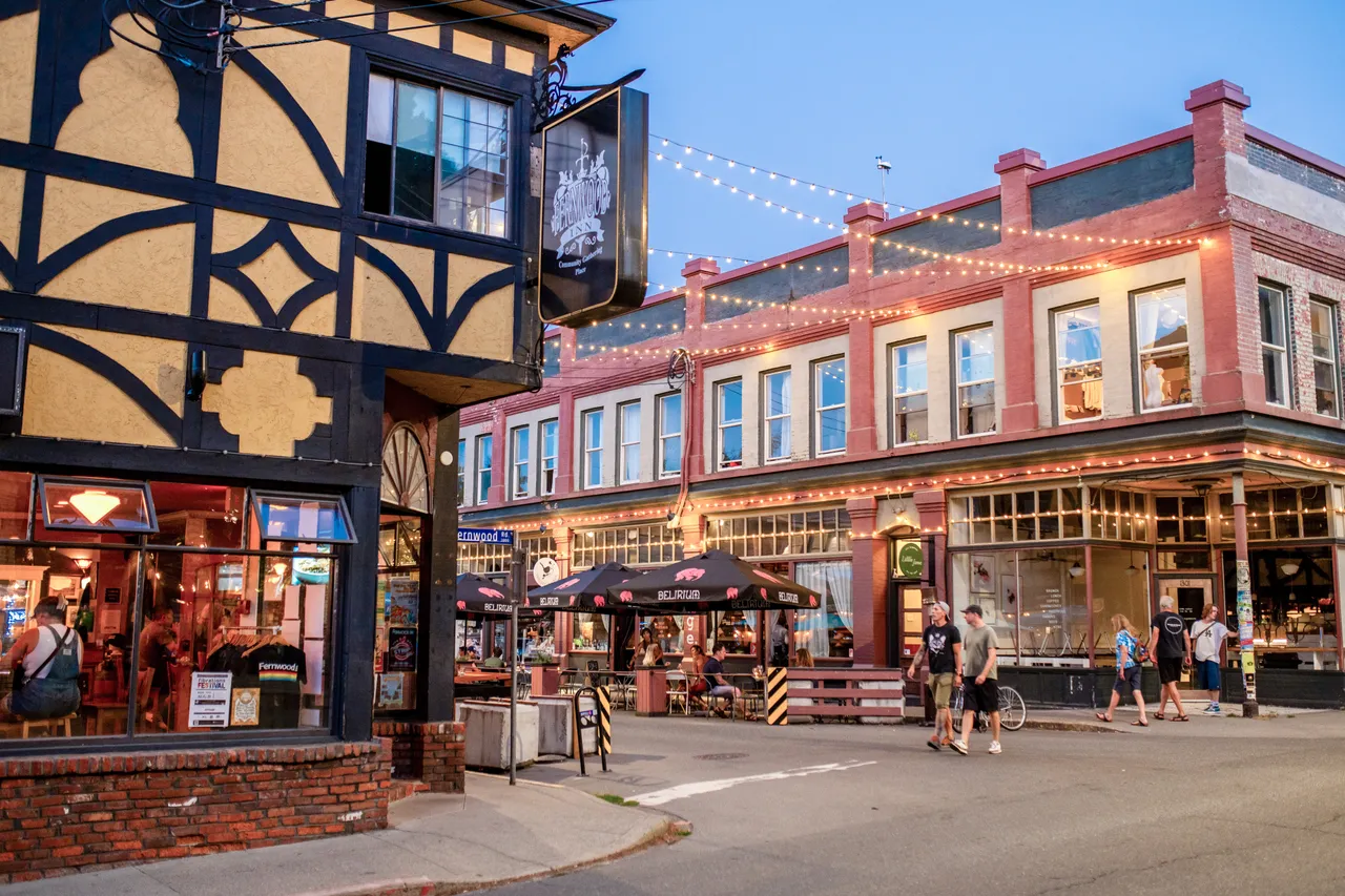 Architecture with string lights and people dining - 2 - Victoria
