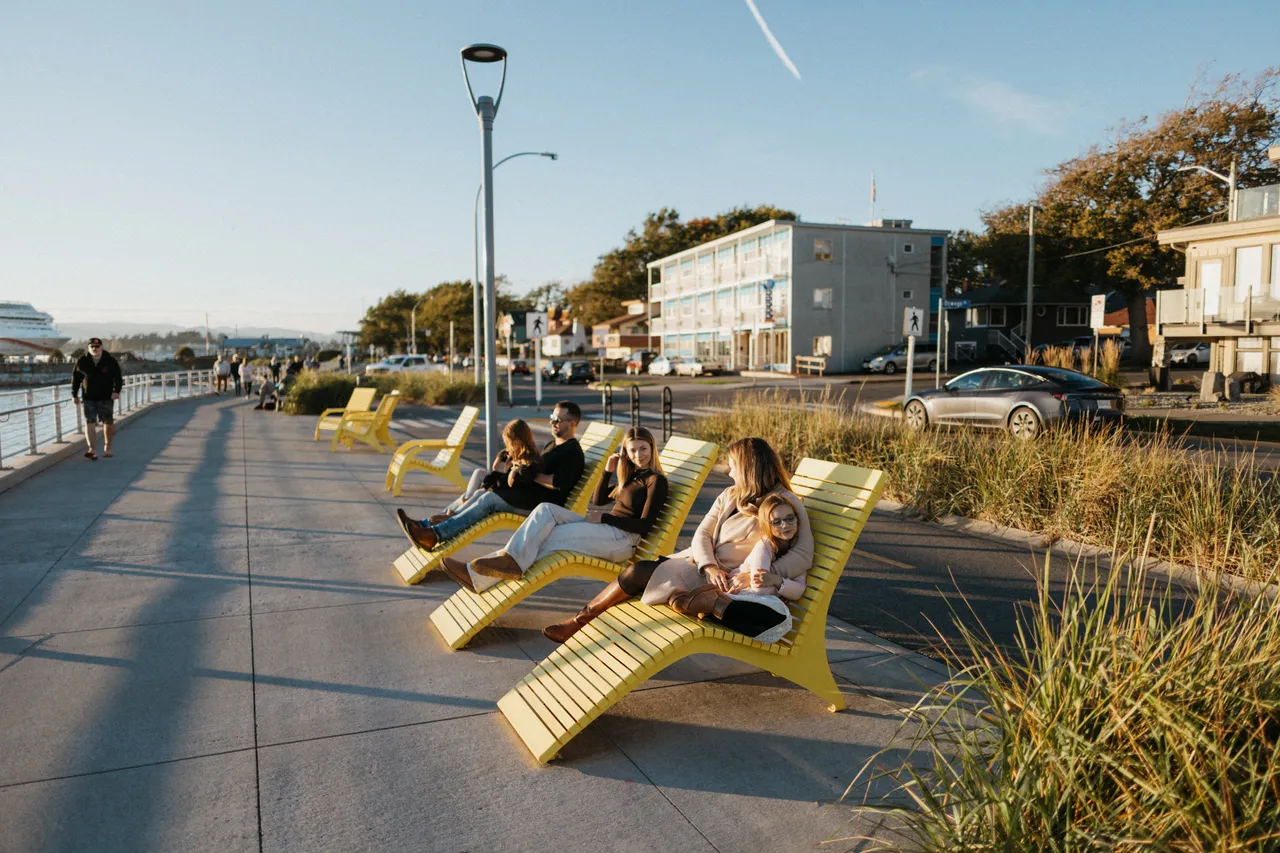 People lounging by ocean - 5