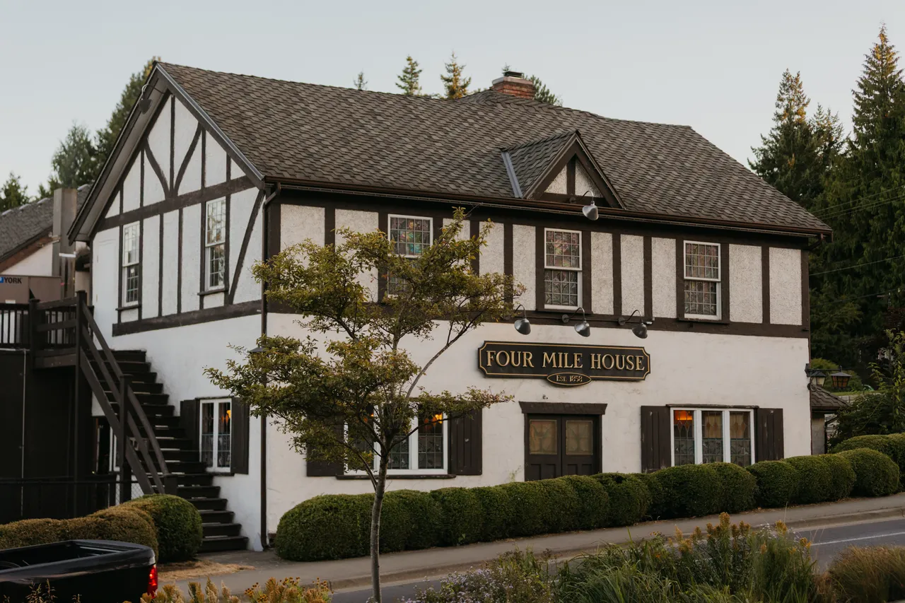 Quaint rustic pub nestled among quiet evergreens
