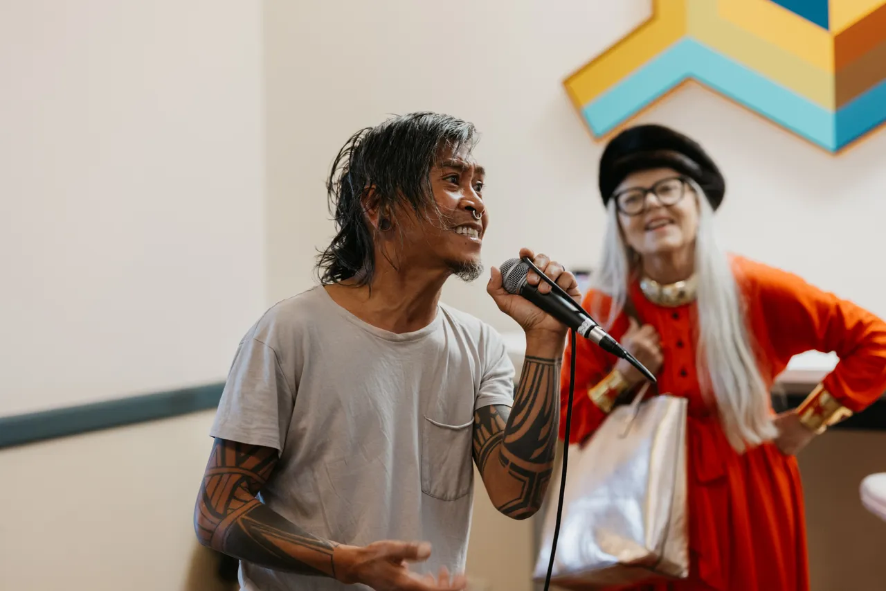 Man using microphone - 1 - VIVA Art Collective