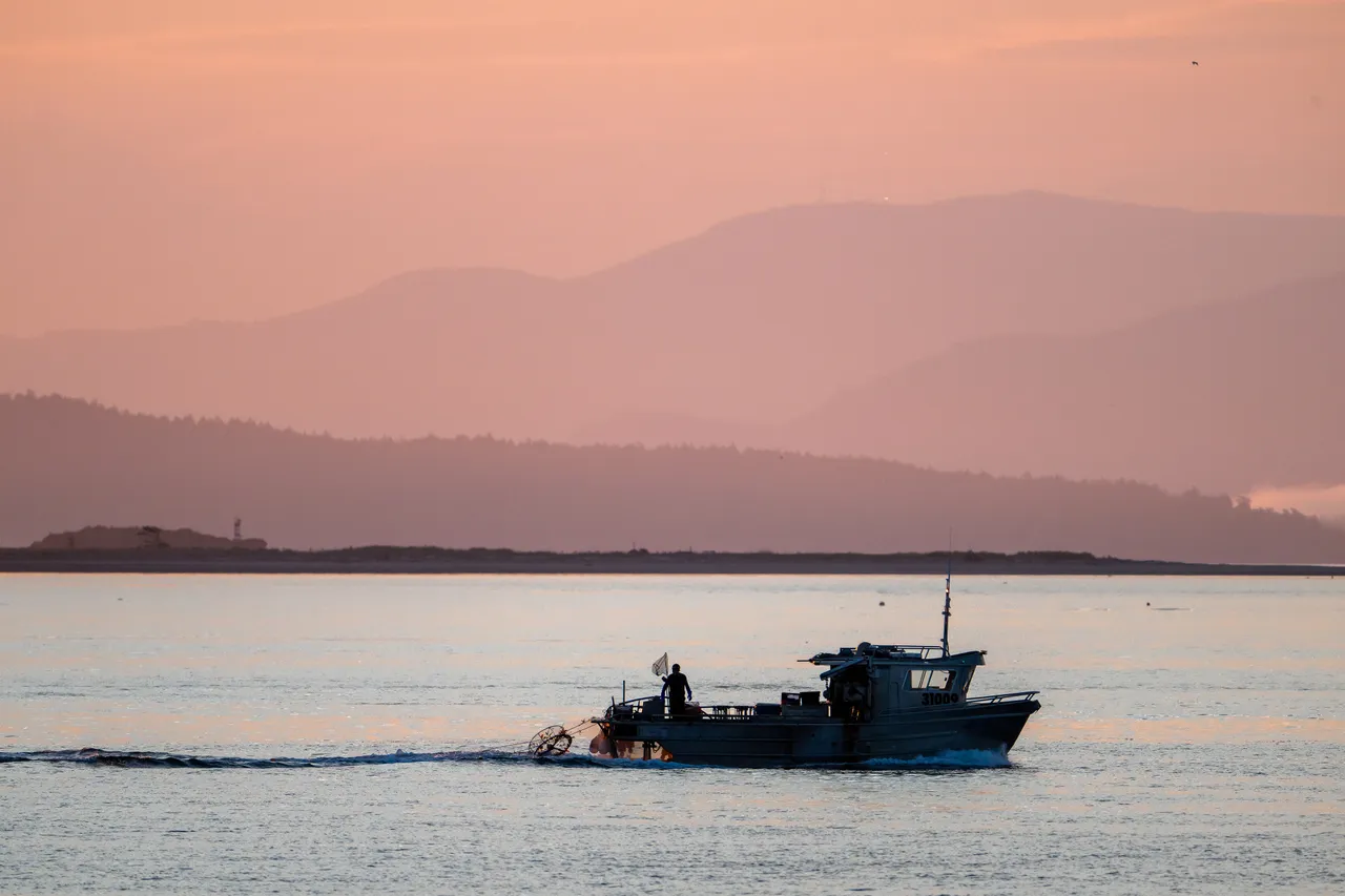 Fishing Boat on Calm Pastel Waters at Dawn