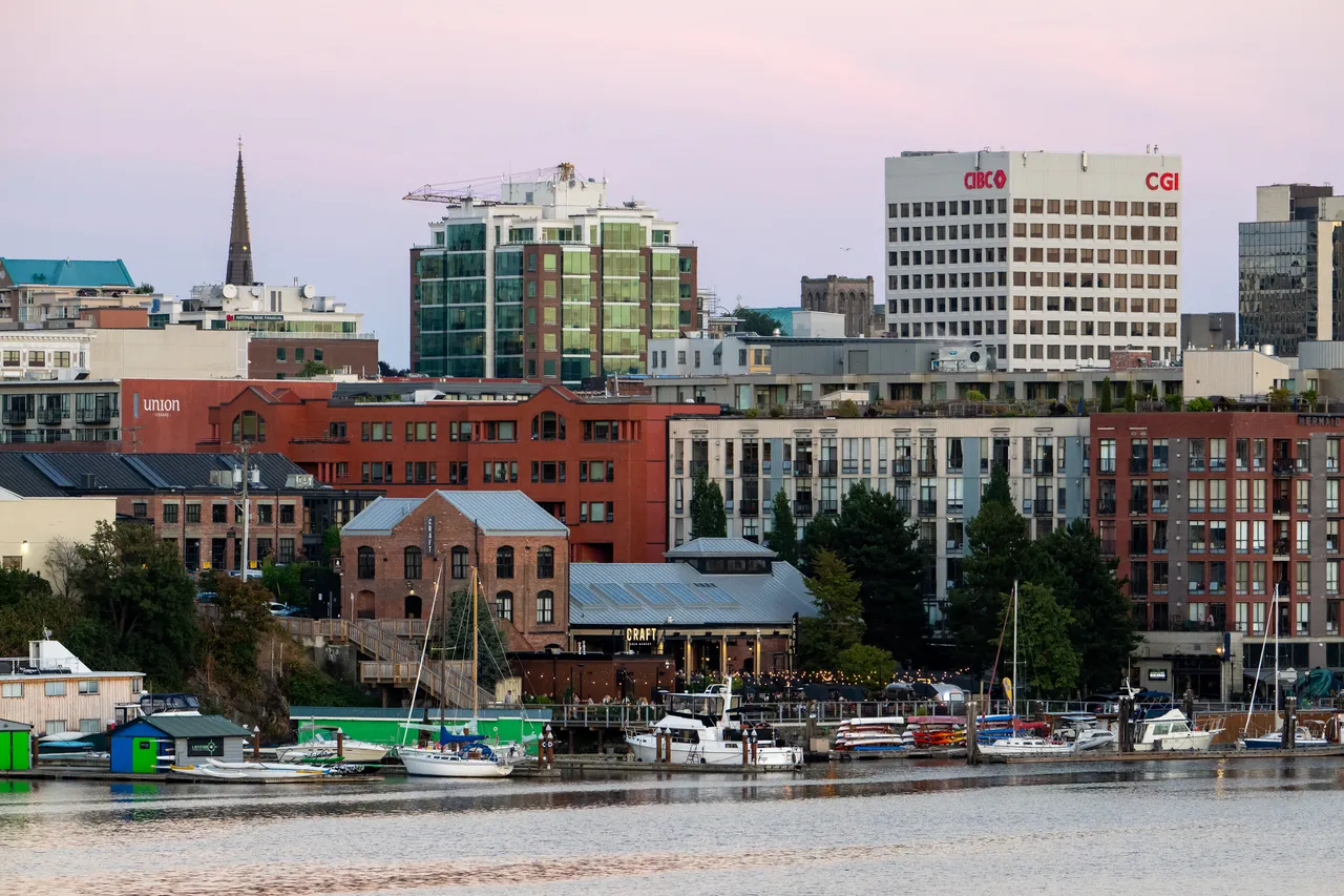 Downtown Victoria at Harbour with Tall Buildings in Background and Boats