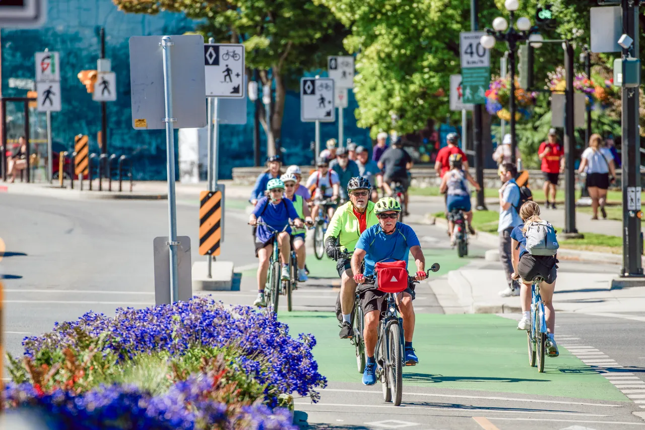 People cycling on street - 4