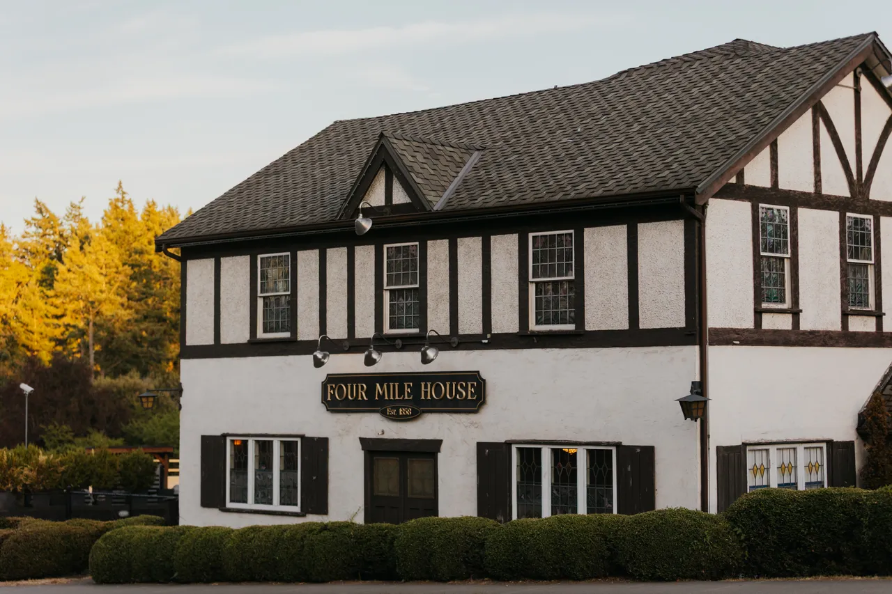 Charming Tudor-style building surrounded by evening greenery