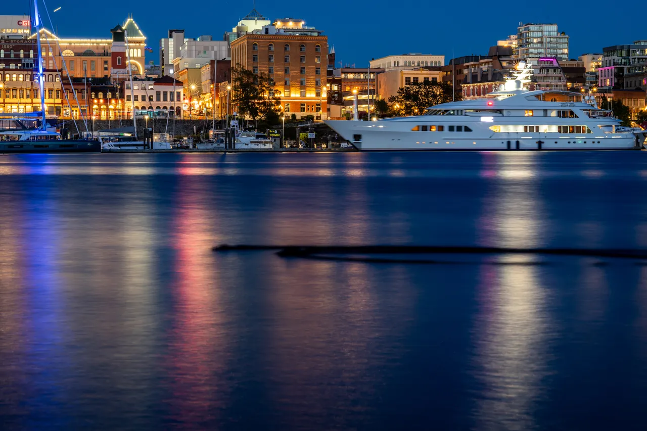 Yacht on Inner Harbour Downtown at Night