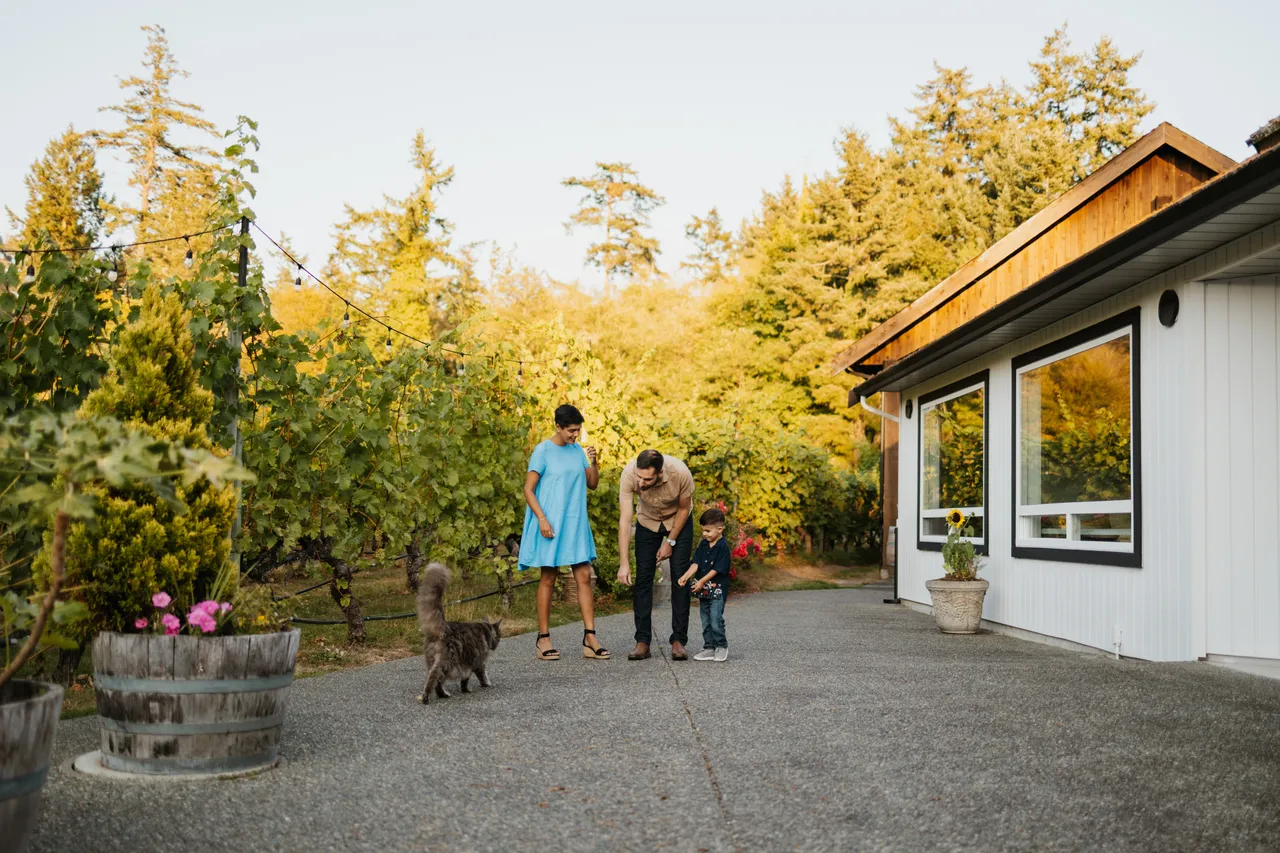 Family enjoying a sunny afternoon by the vineyard