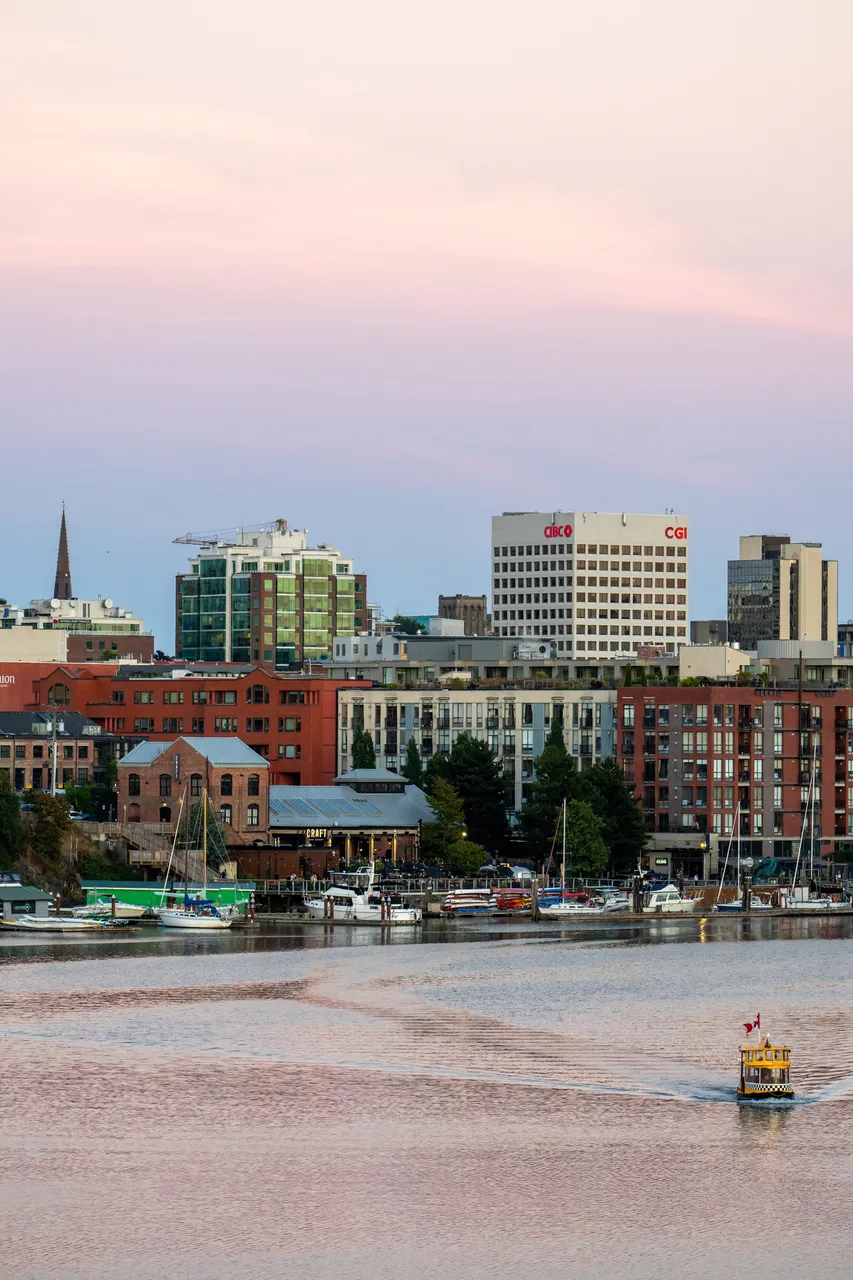 Harbour Taxi with City Buildings in Background during the Daytime