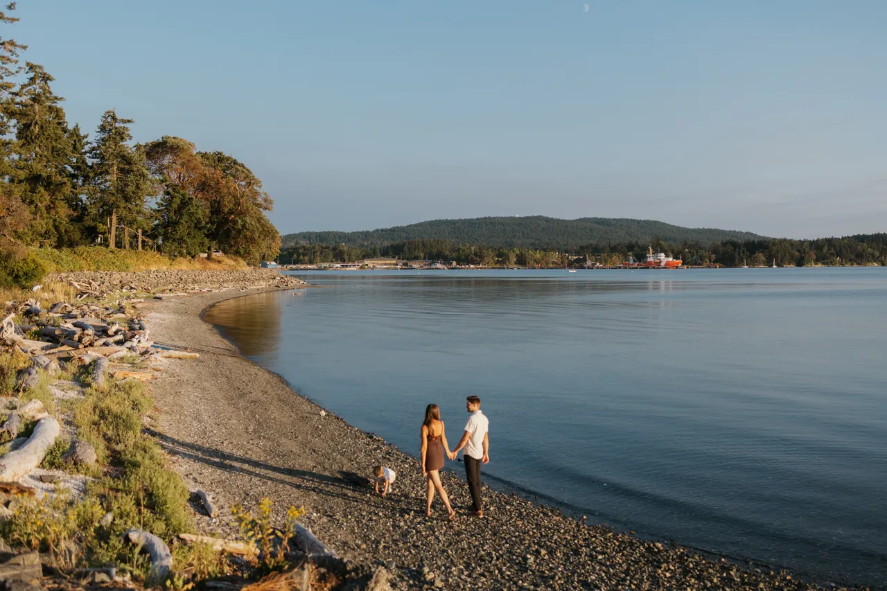Peaceful family walk along a quiet coastal shore