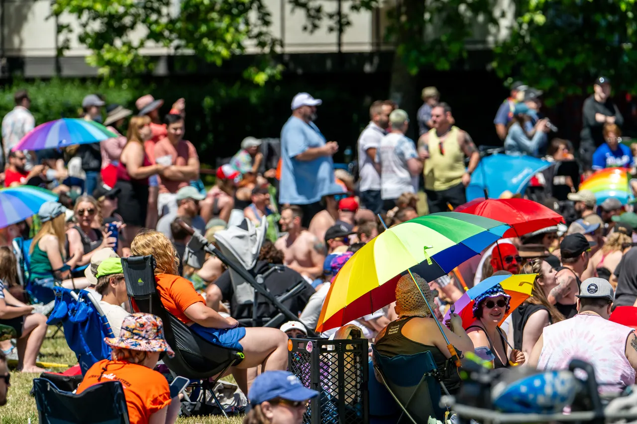 Memorial Drag Baseball Game with Crowd and Umbrellas