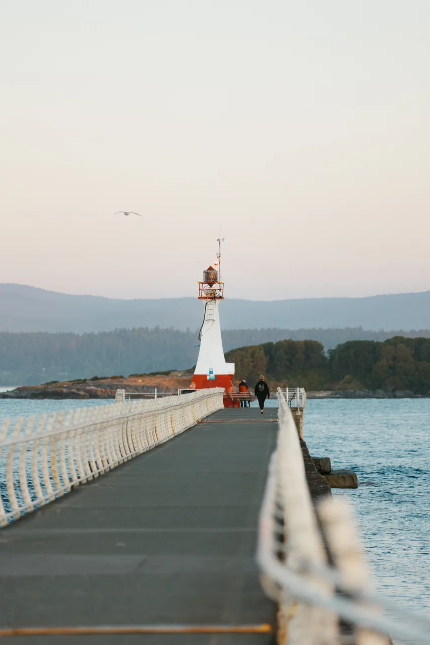 Evening walk along breakwater at sunset