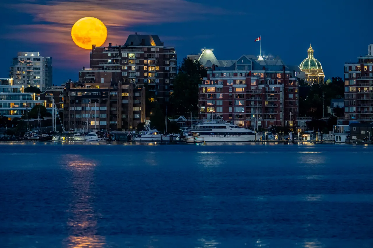 Downtown Victoria Harbour with Boats and Moon Rising from Far Away