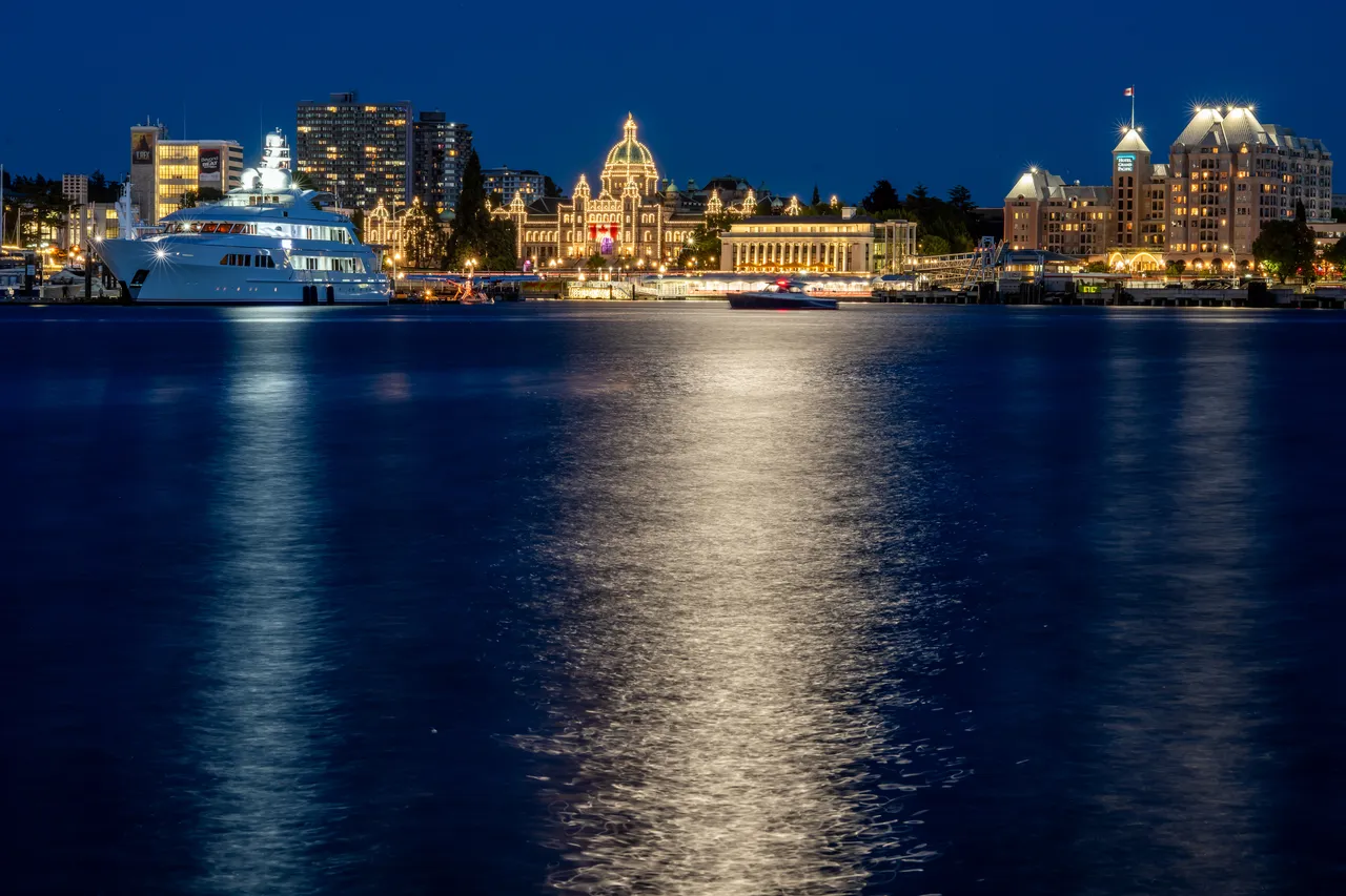 Downtown Harbour at Night with Parliament Building and Yacht on Water